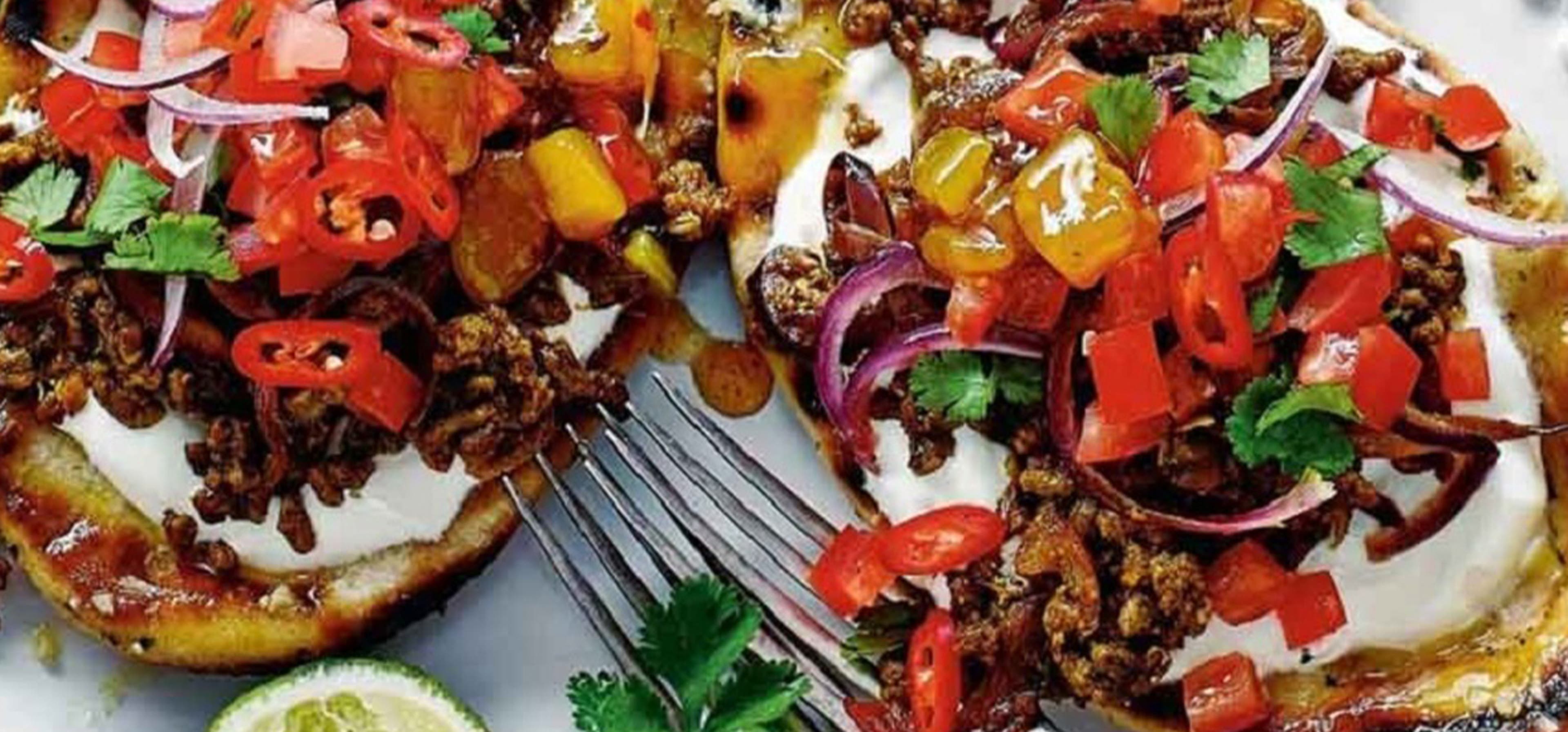 An assortment of different foods including stuffed peppers