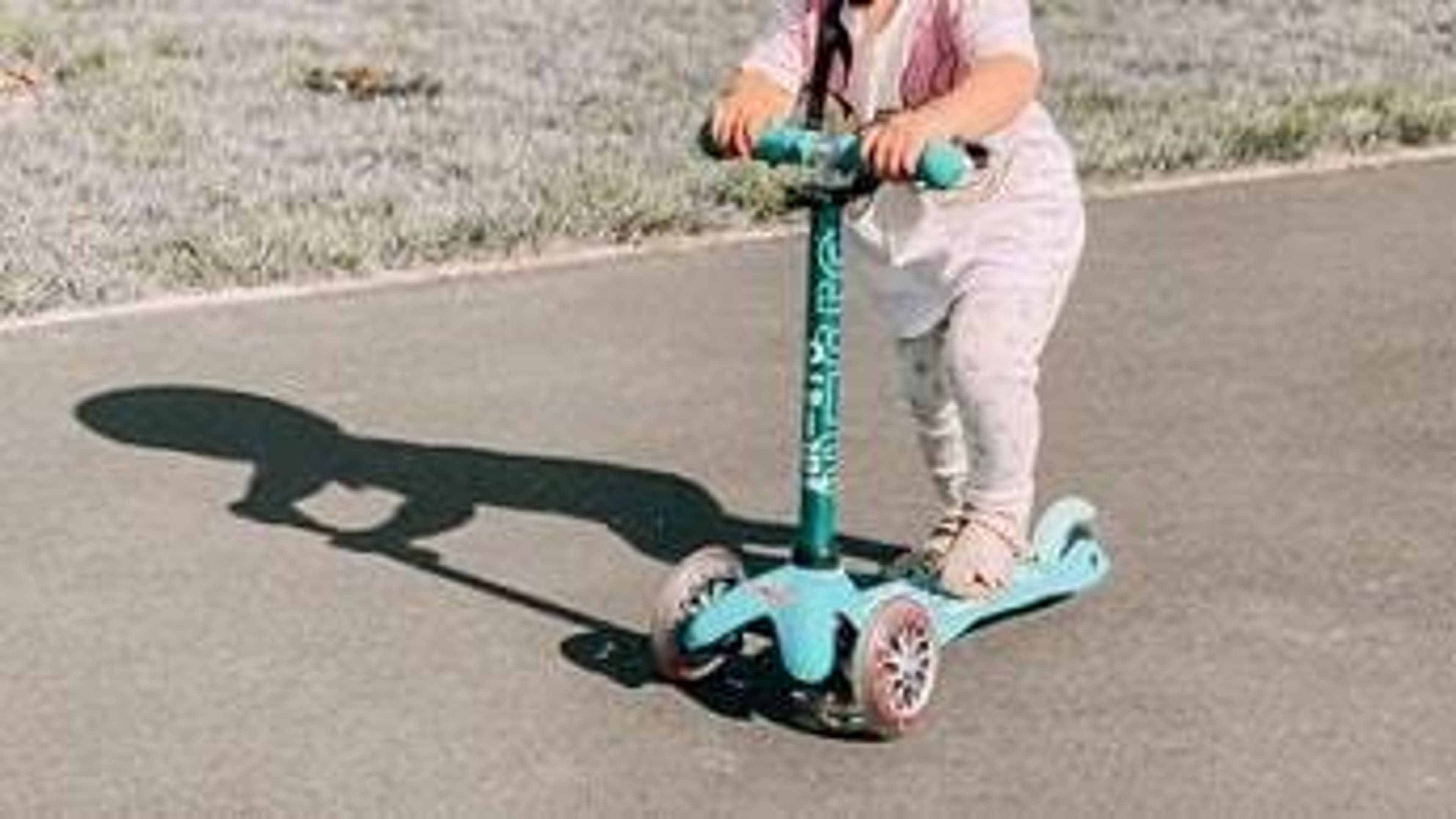  A child rides a personalised scooter from Micro Scooters 