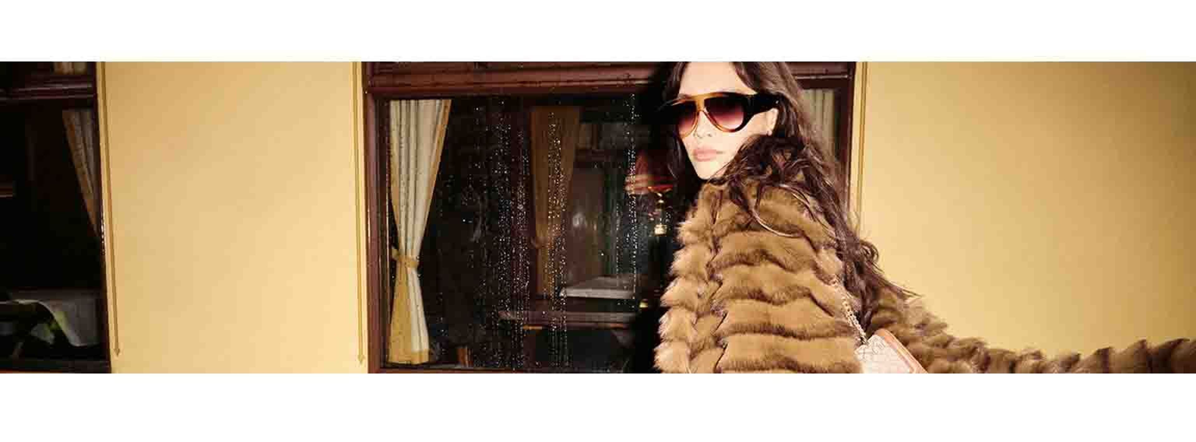 women in big sunglasses and fur coat