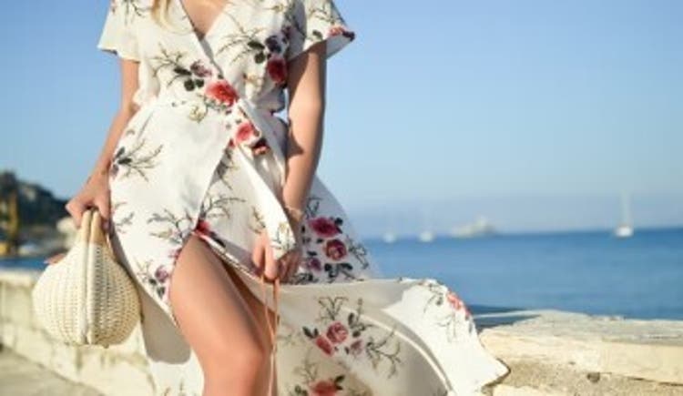  Floral maxi dress and sunhat on the beach 