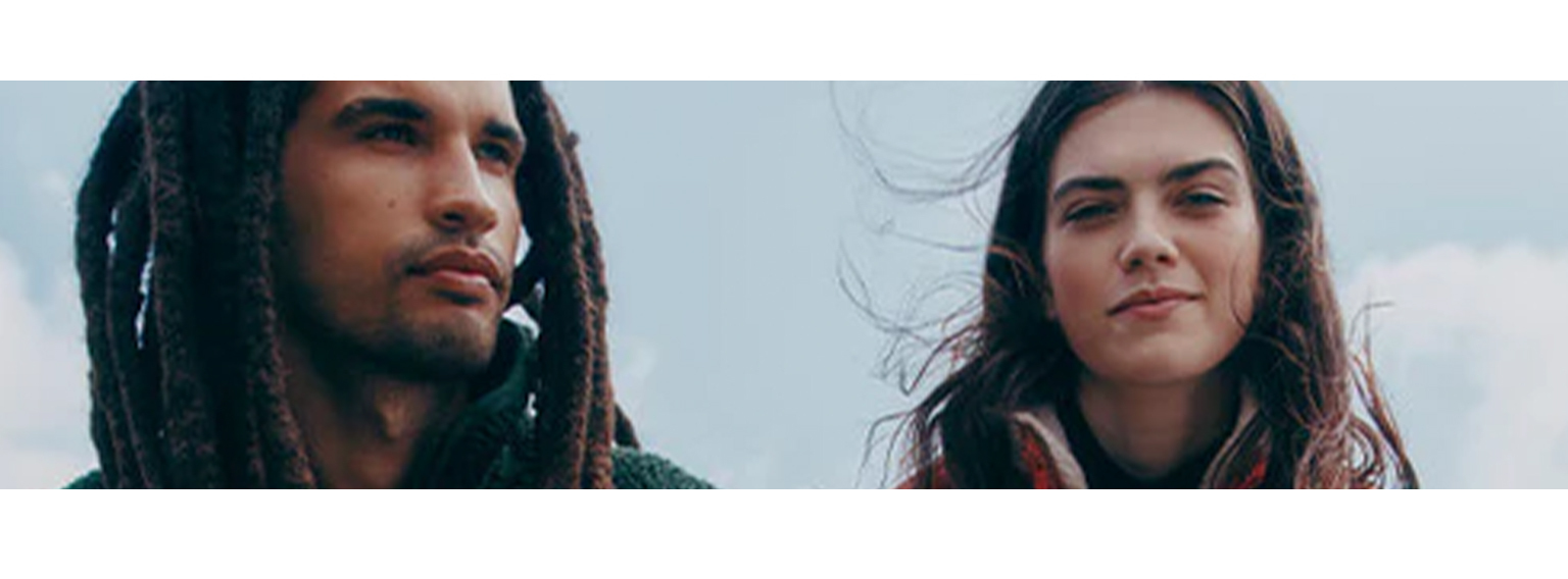  woman and a man posing  