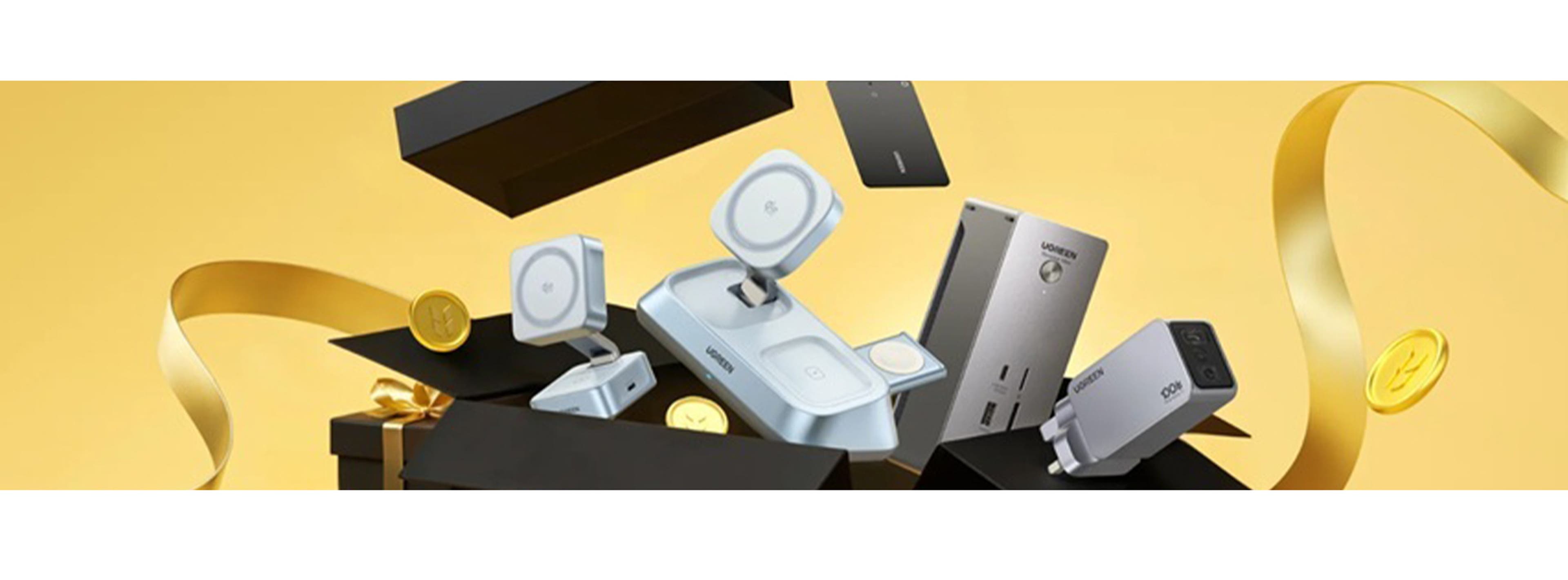 collection of tech coming out of a black box with golden ribbons