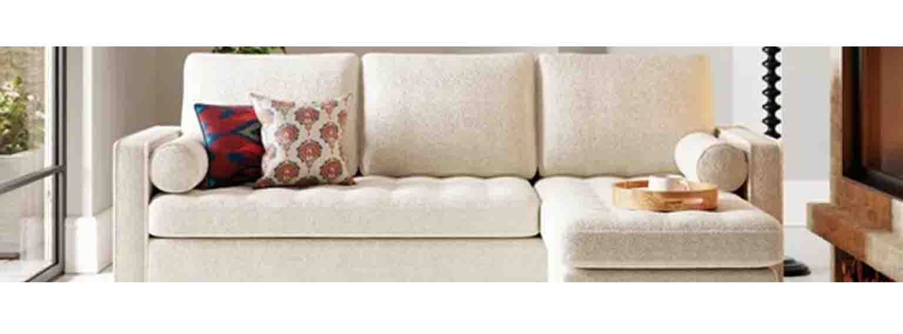 long white cream sofa in natural lighting