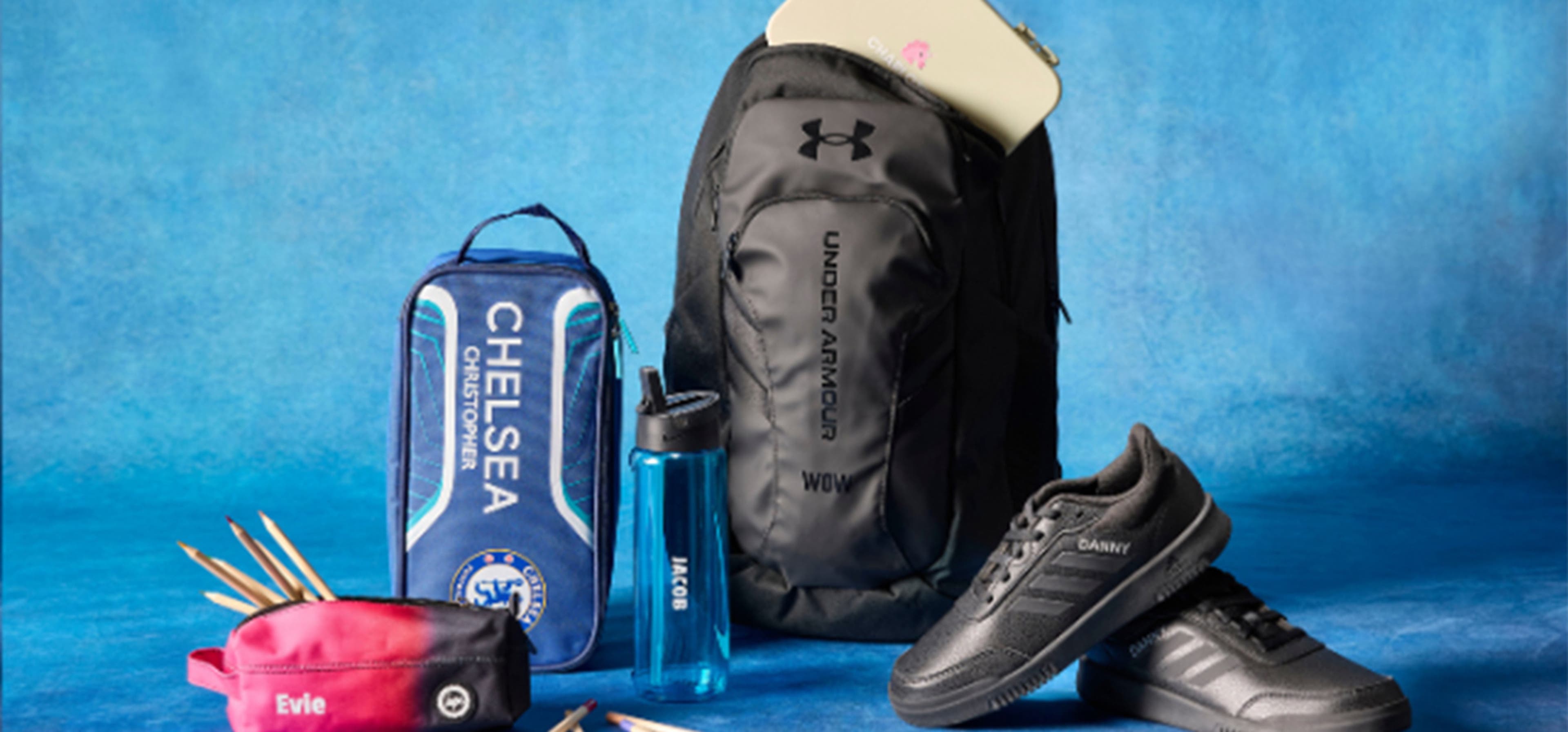 Blue background with sports equipment and clothing in centre
