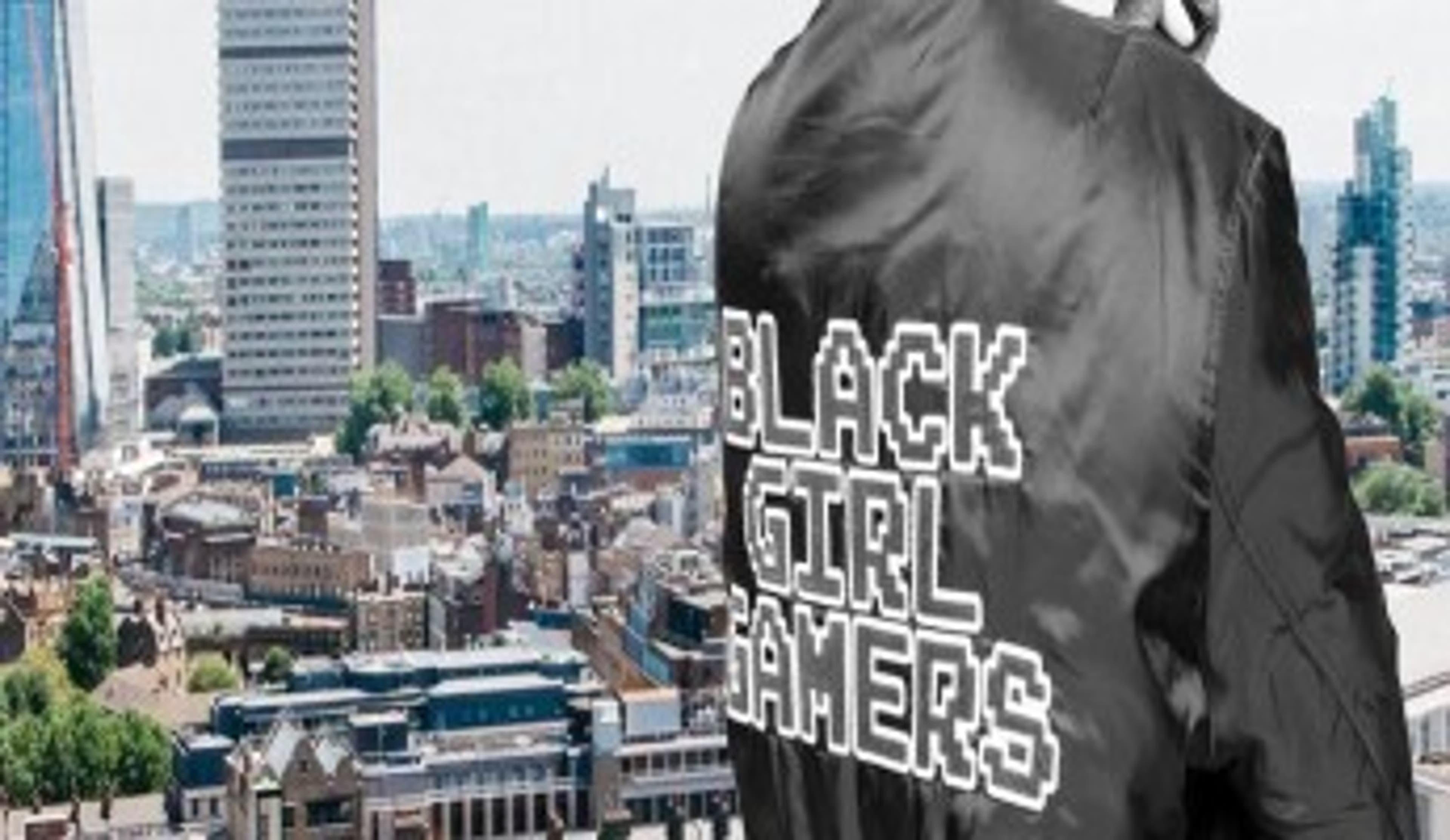  Black bomber jacket with stitch lettering 'Black Girl Gamers' on London city-scape 