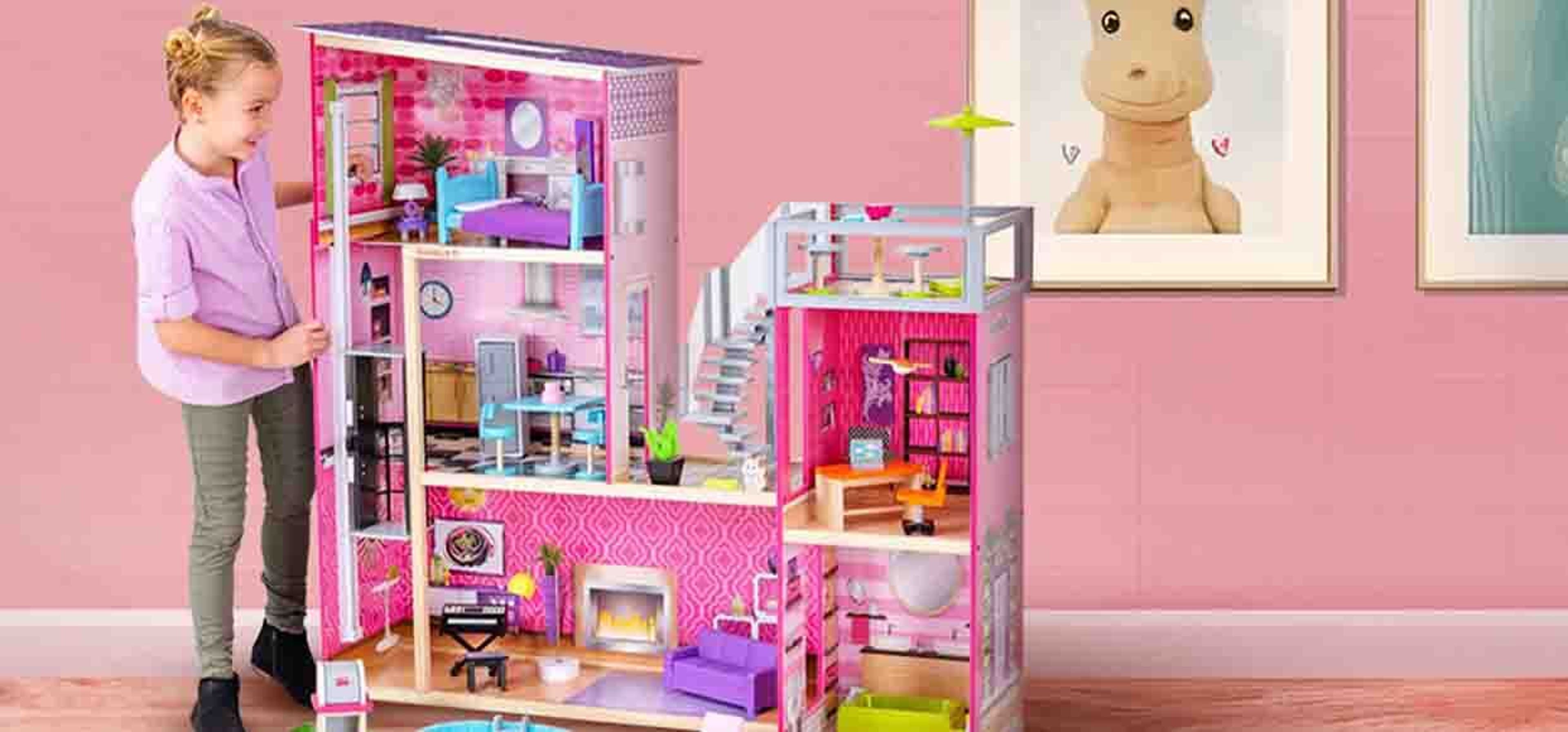 little girl with massive doll house