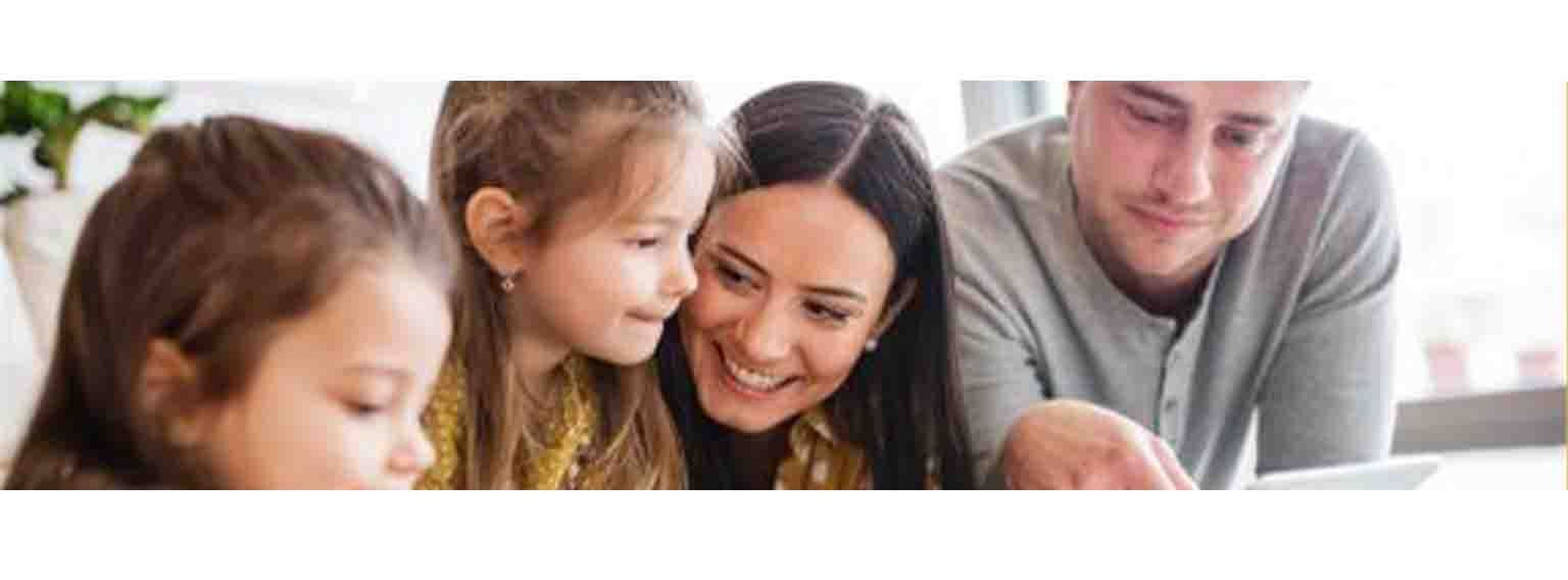 family sat together choosing holiday