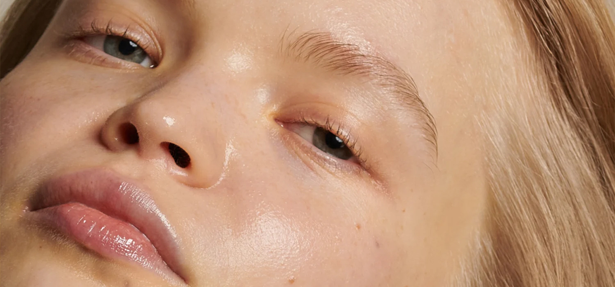  close up shot of a woman with no make up on  