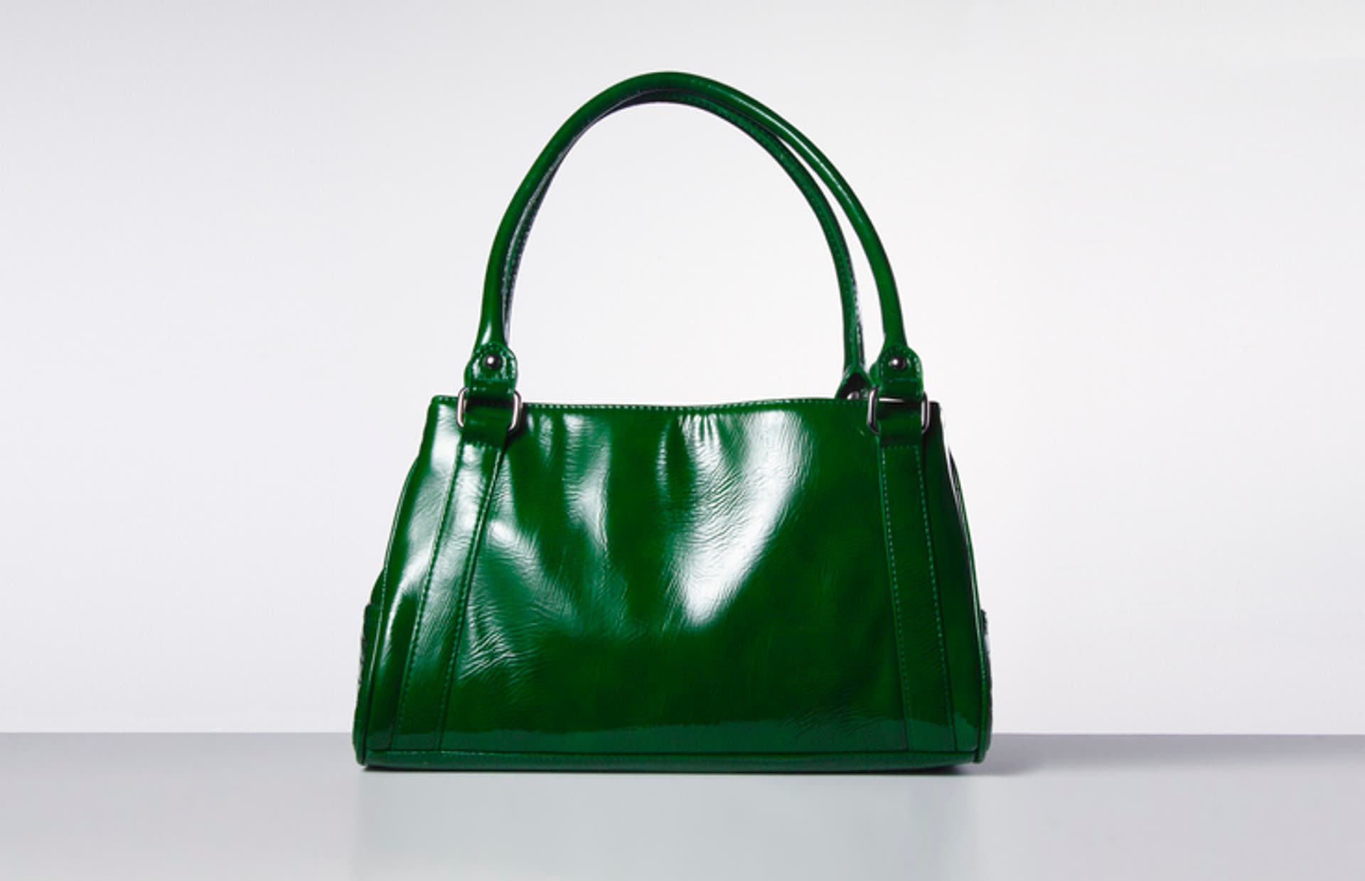  Green handbag on white. 