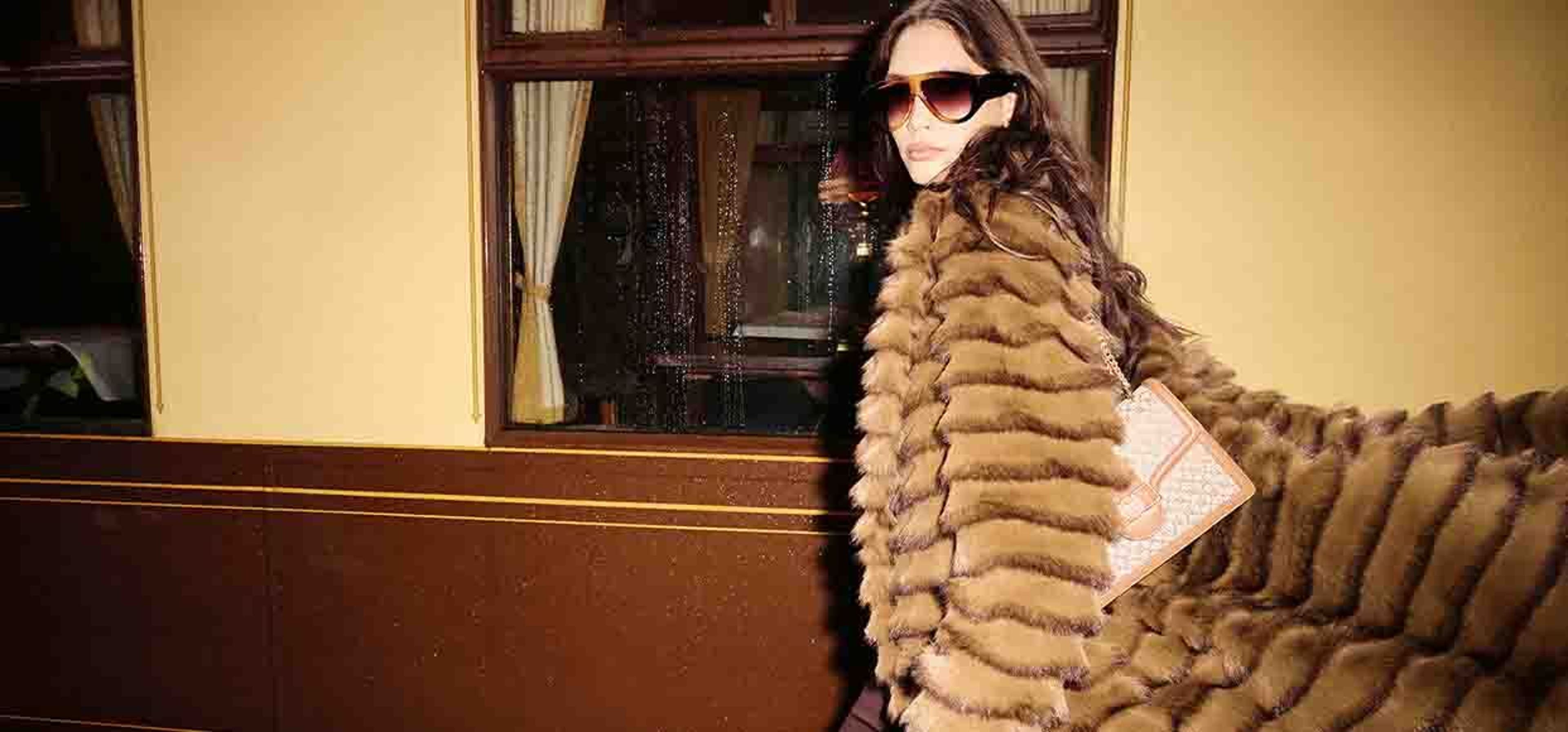 woman in sunglasses and fur coat
