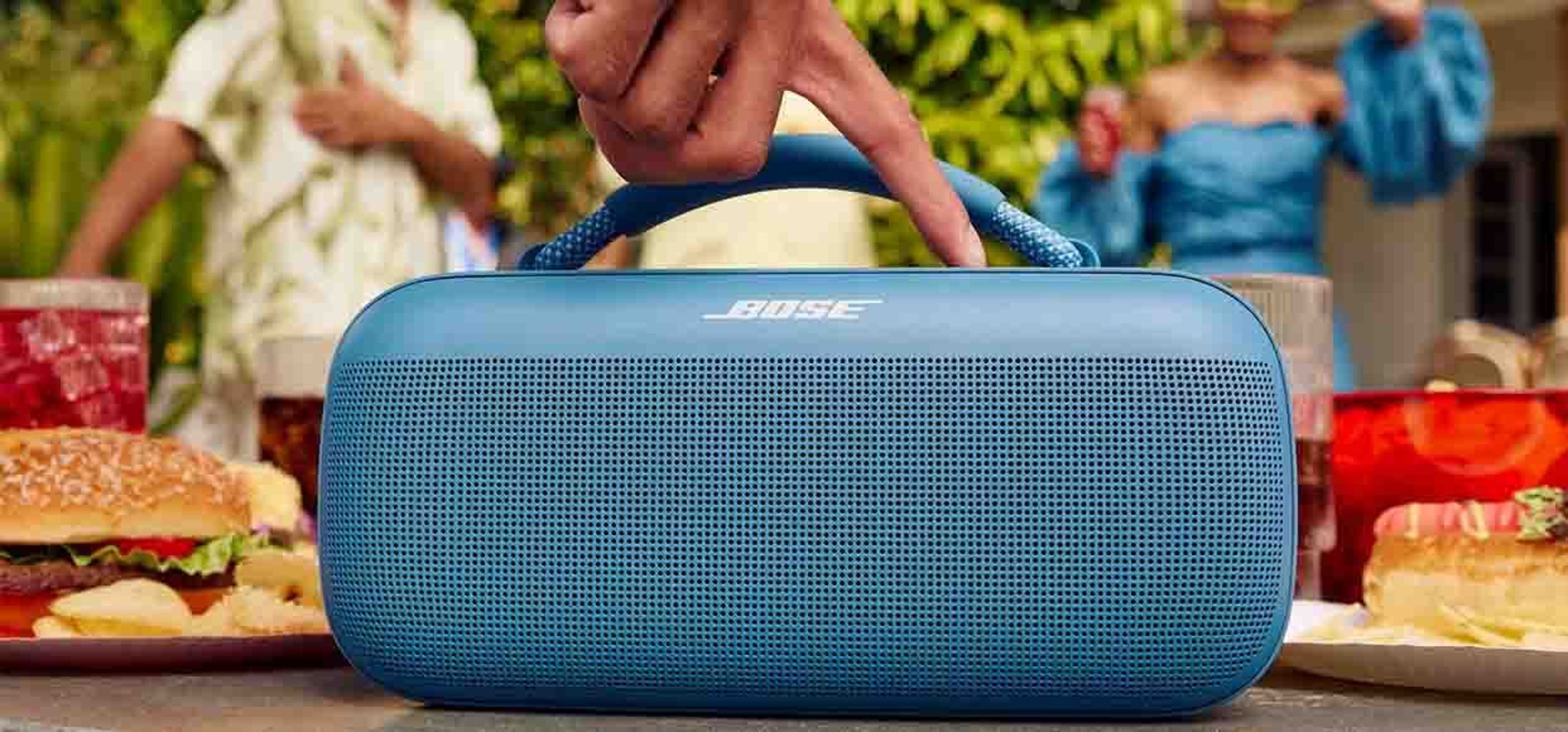 Garden party with blue bose speaker in centre of image