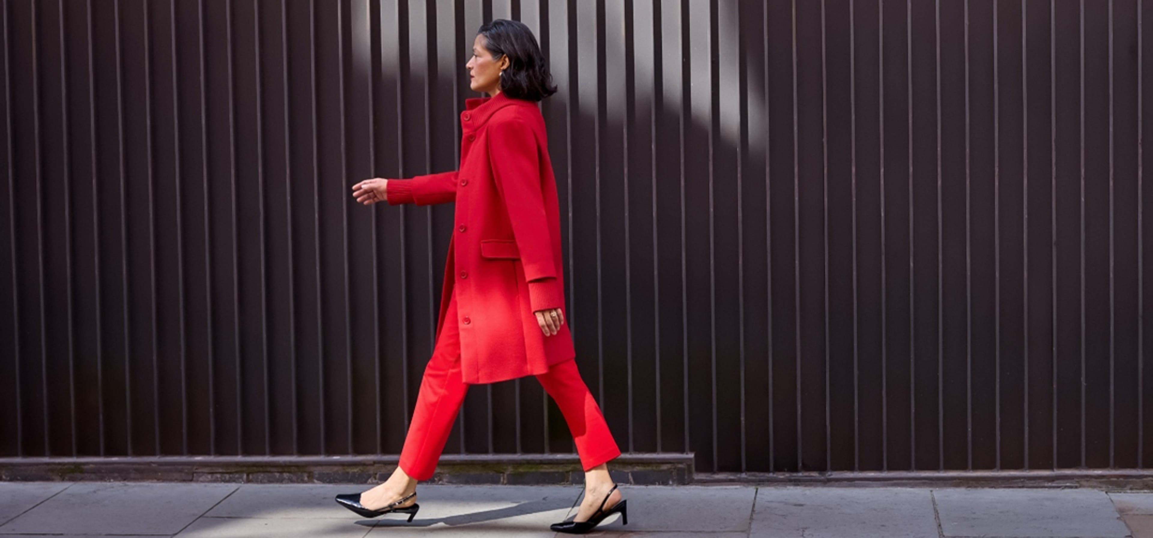 woman in red outfit walking