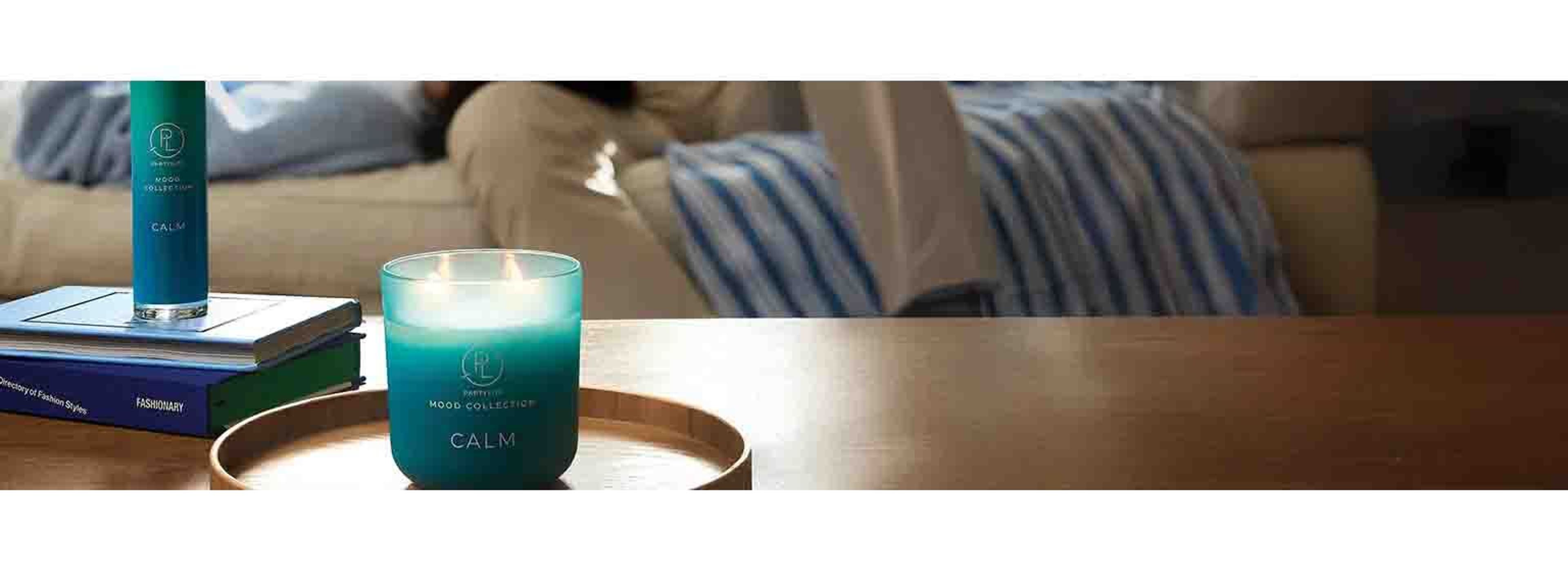picture of a blue candle labelled 'calm' on a living room table