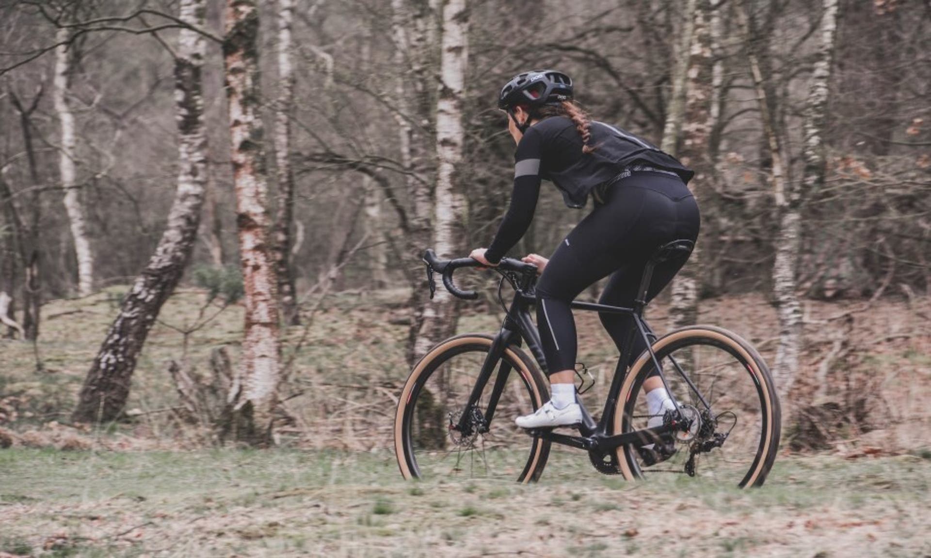  female cyclist cycling in the countryside 