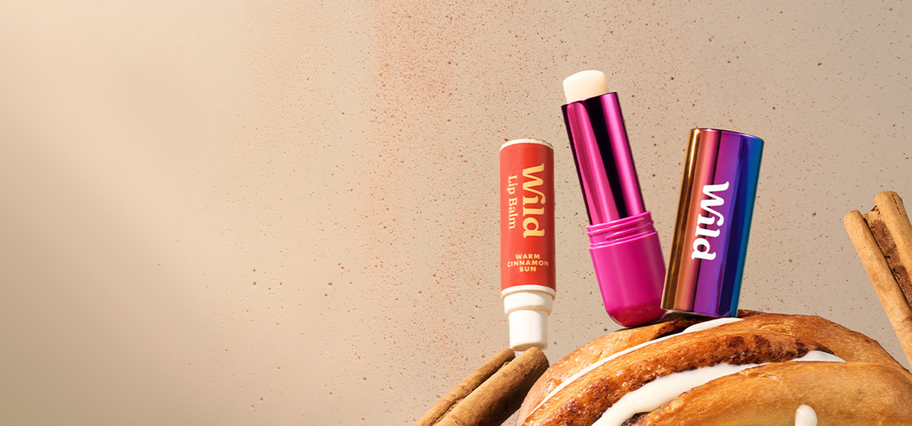 Three wild cosmetic items sitting on top of a tree branch