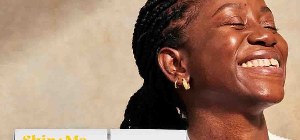  A woman smiling with clear skin 