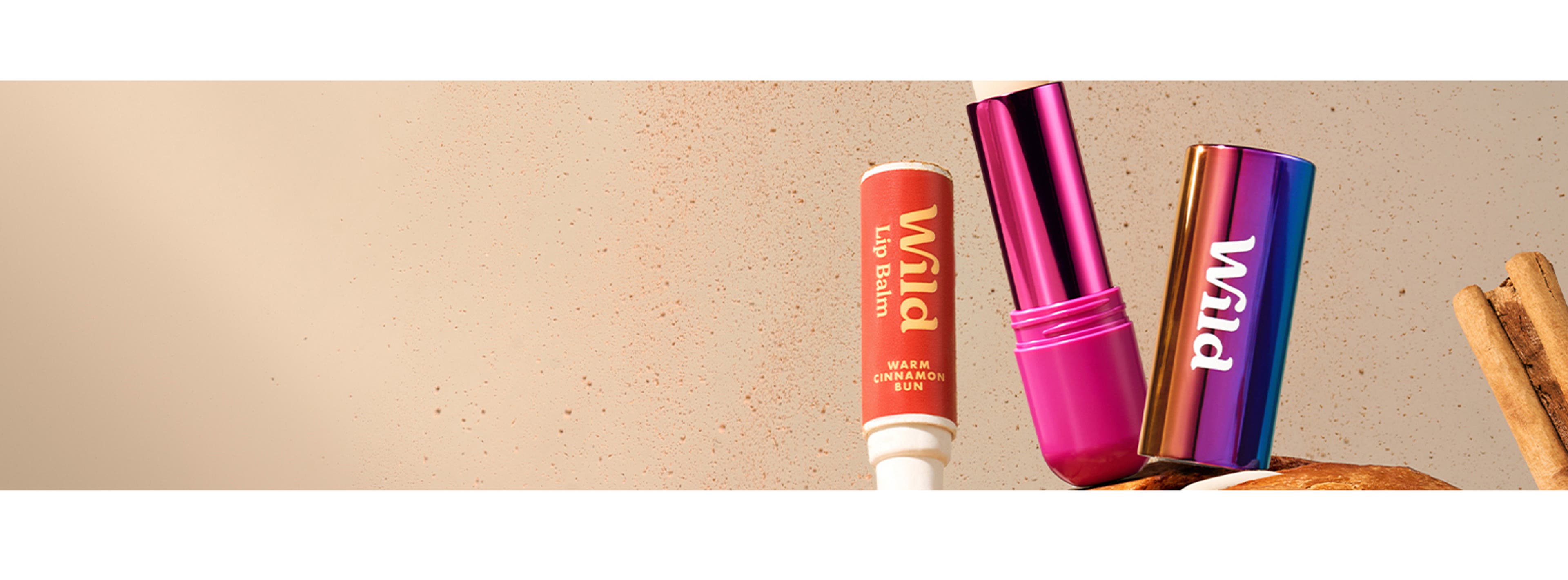 Three wild cosmetic items sitting on top of a tree branch