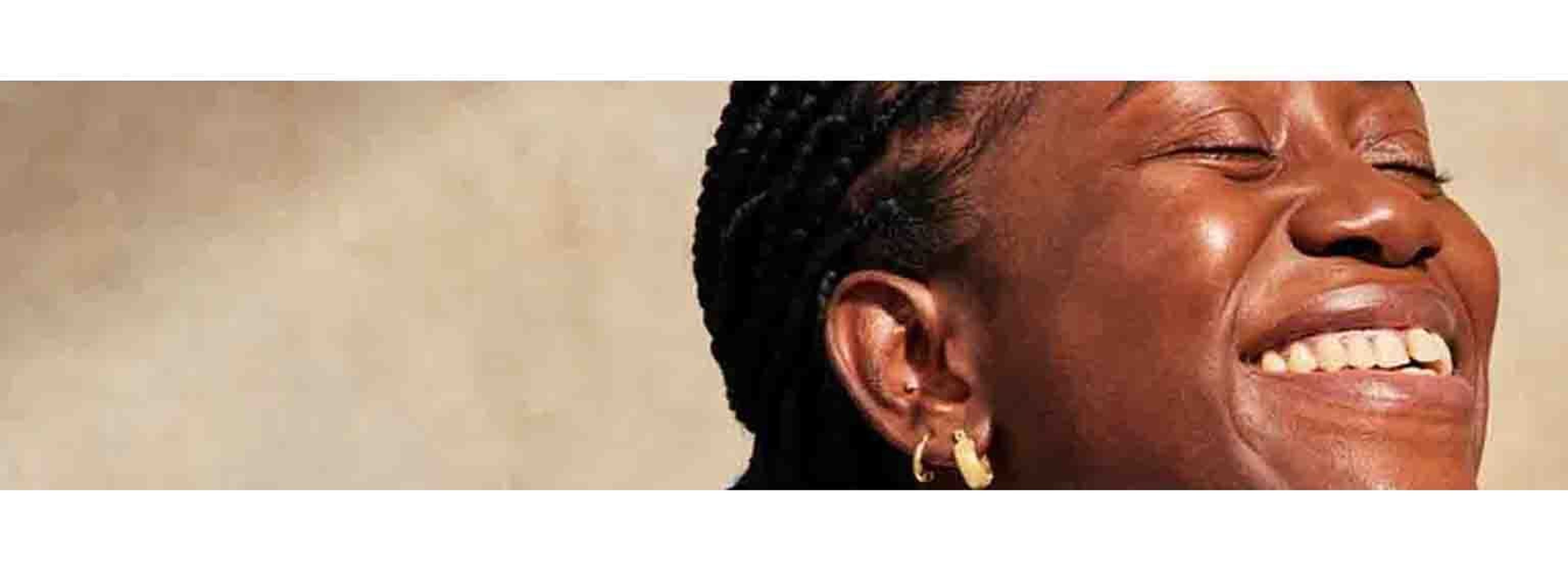 A woman smiling with clear skin