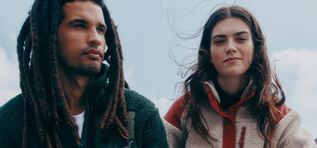  woman and a man posing  