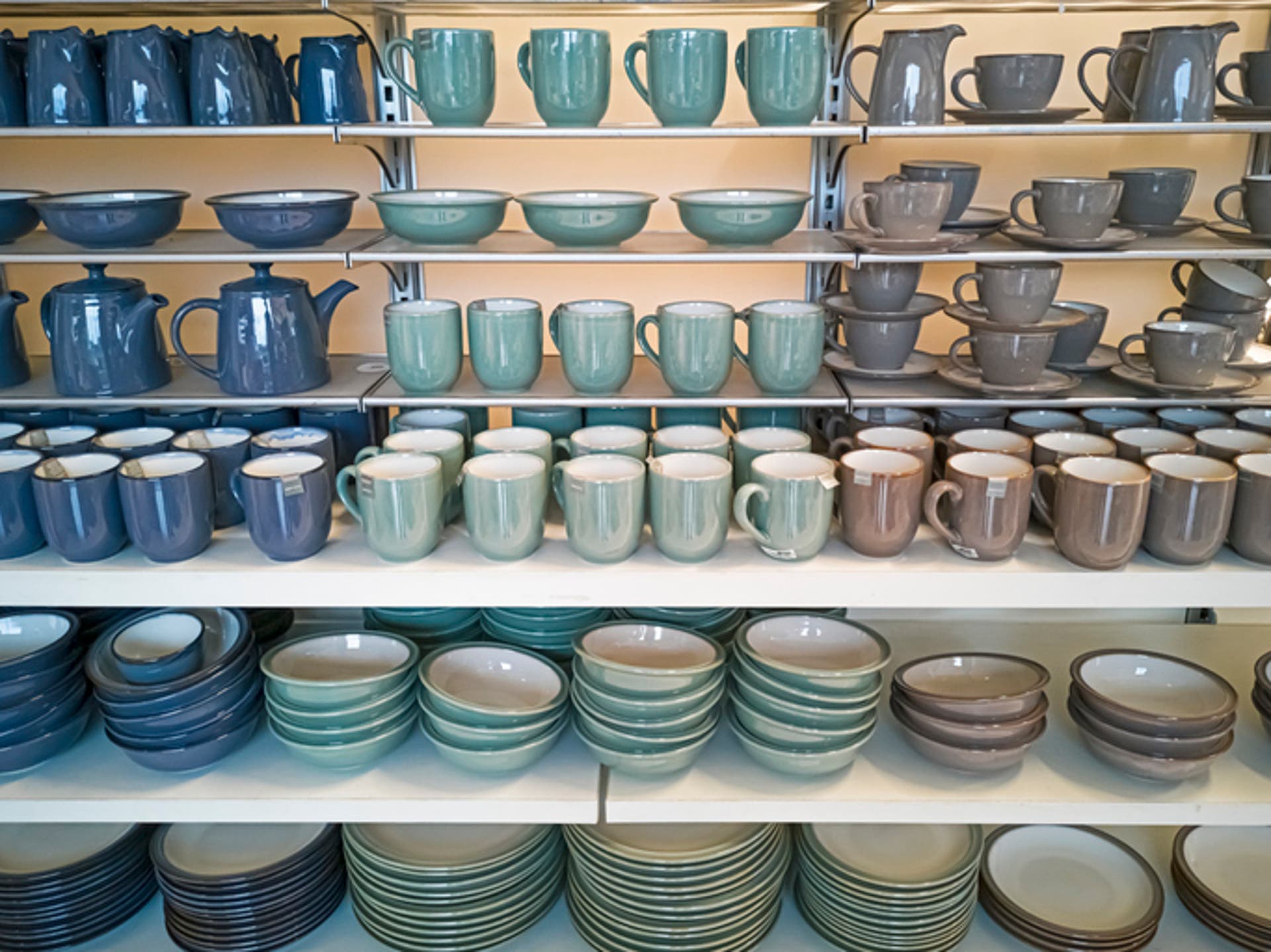  Crockery, porcelain, utensils and other items on shop shelf 