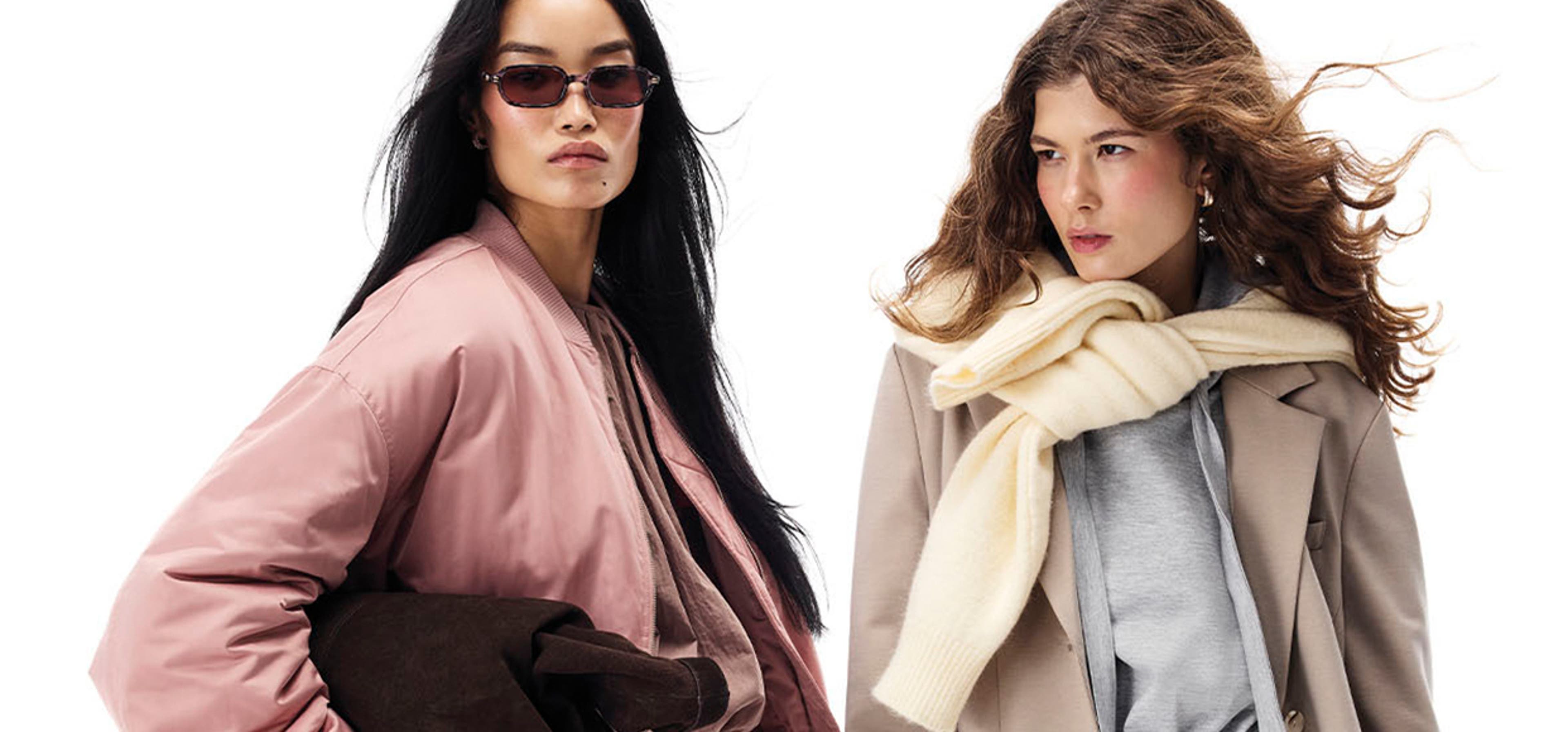 two models posing with a white background