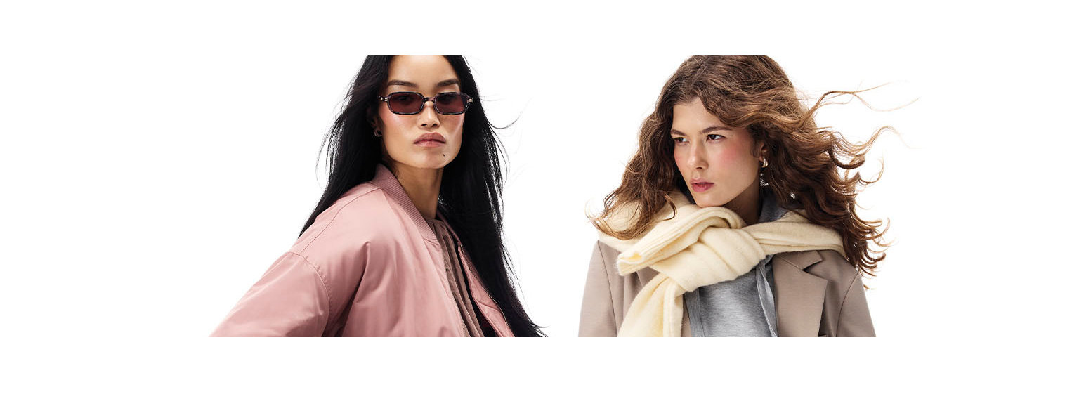  two models posing with a white background 