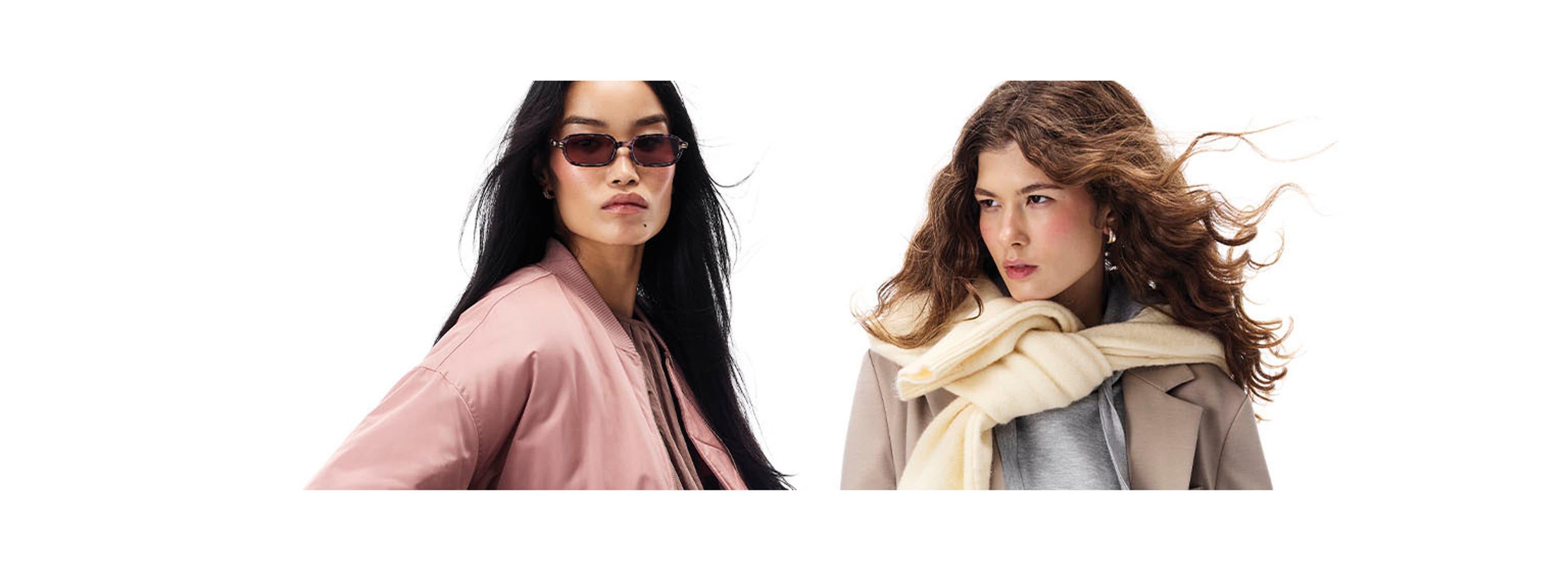 two models posing with a white background