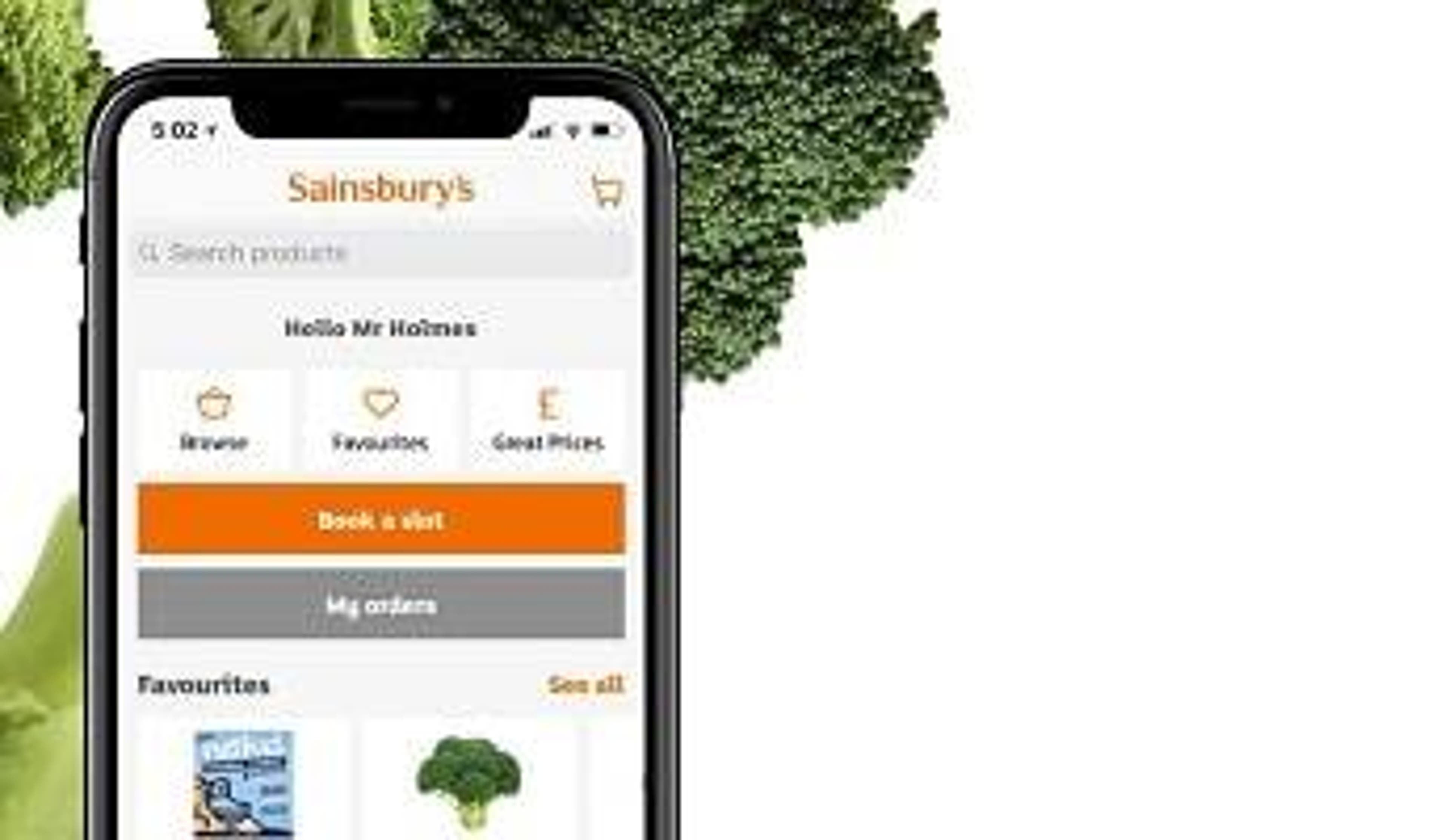  An iPhone with the Sainsbury's Groceries app open and some broccoli in the background 