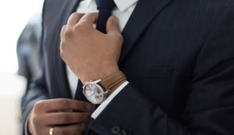  Black suit with white shirt and black tie with smart watch 