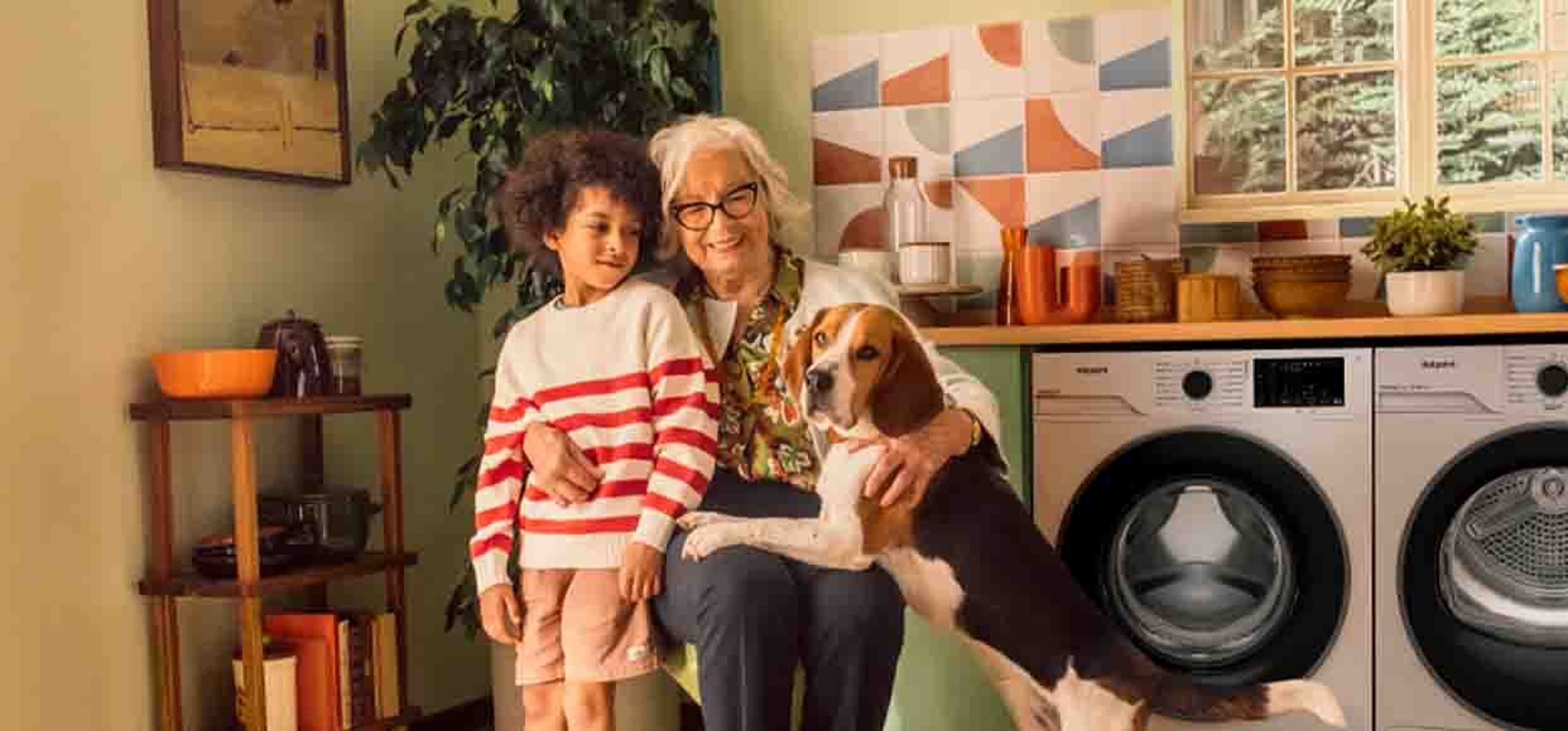 an elderly woman with young boy and beagle