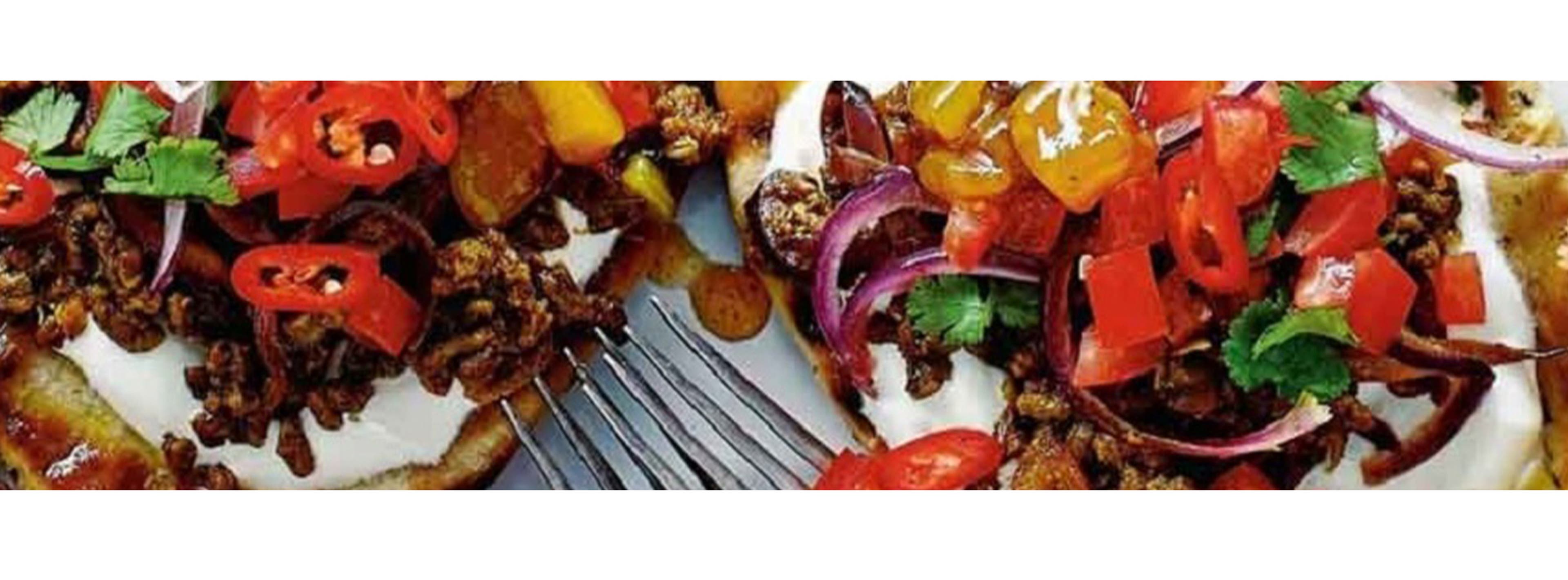 An assortment of different foods including stuffed peppers