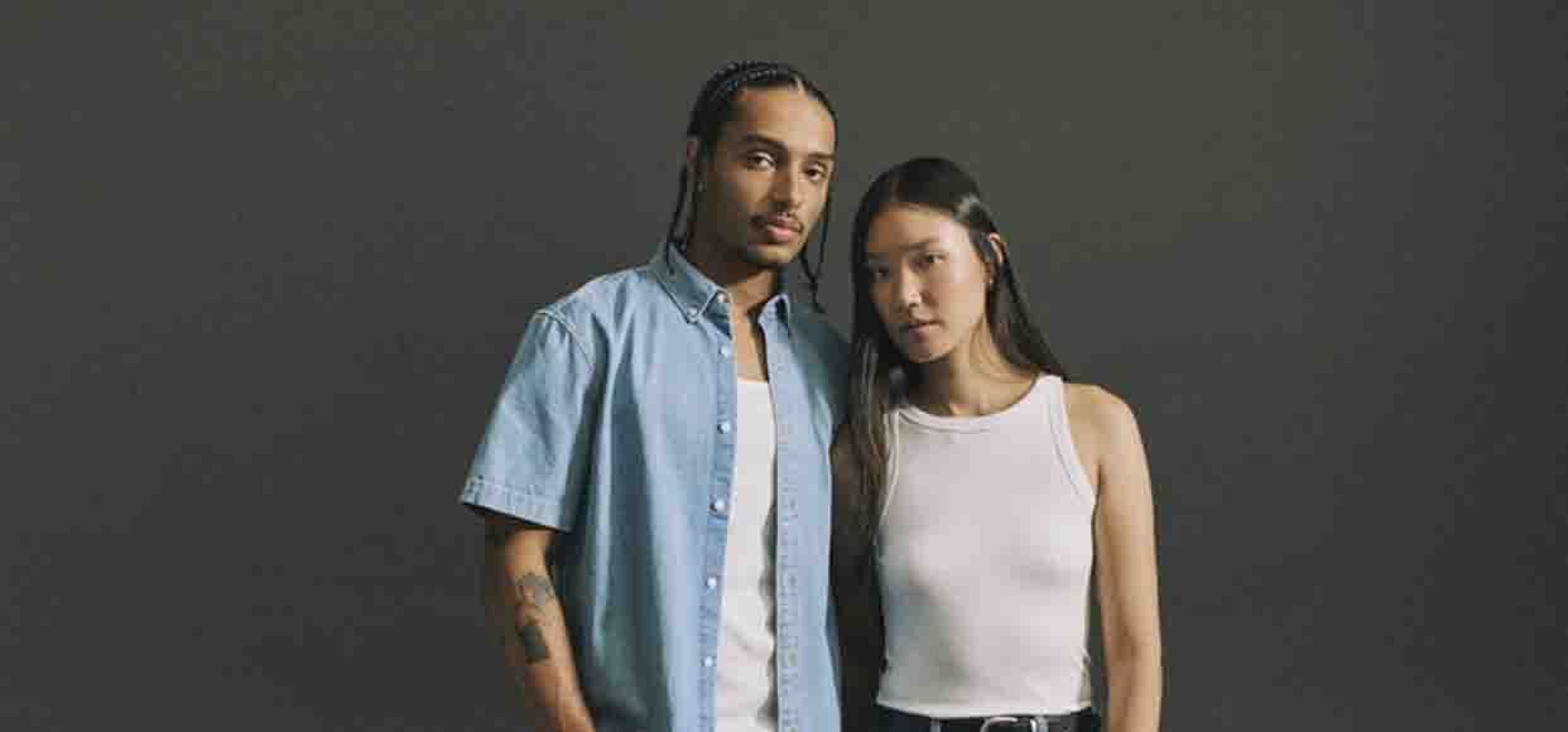 two people posing in all denim outfits