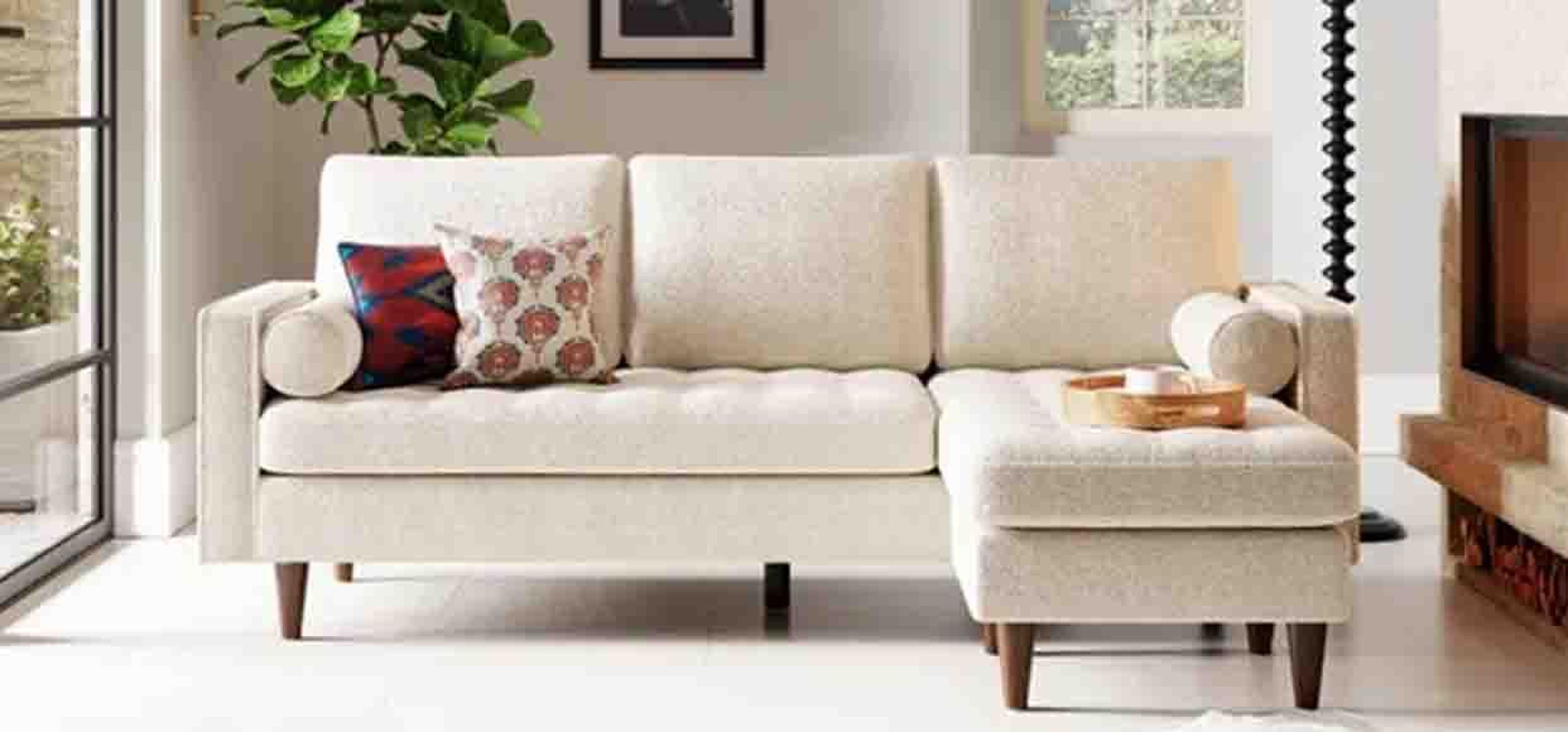 long white cream sofa in natural lighting