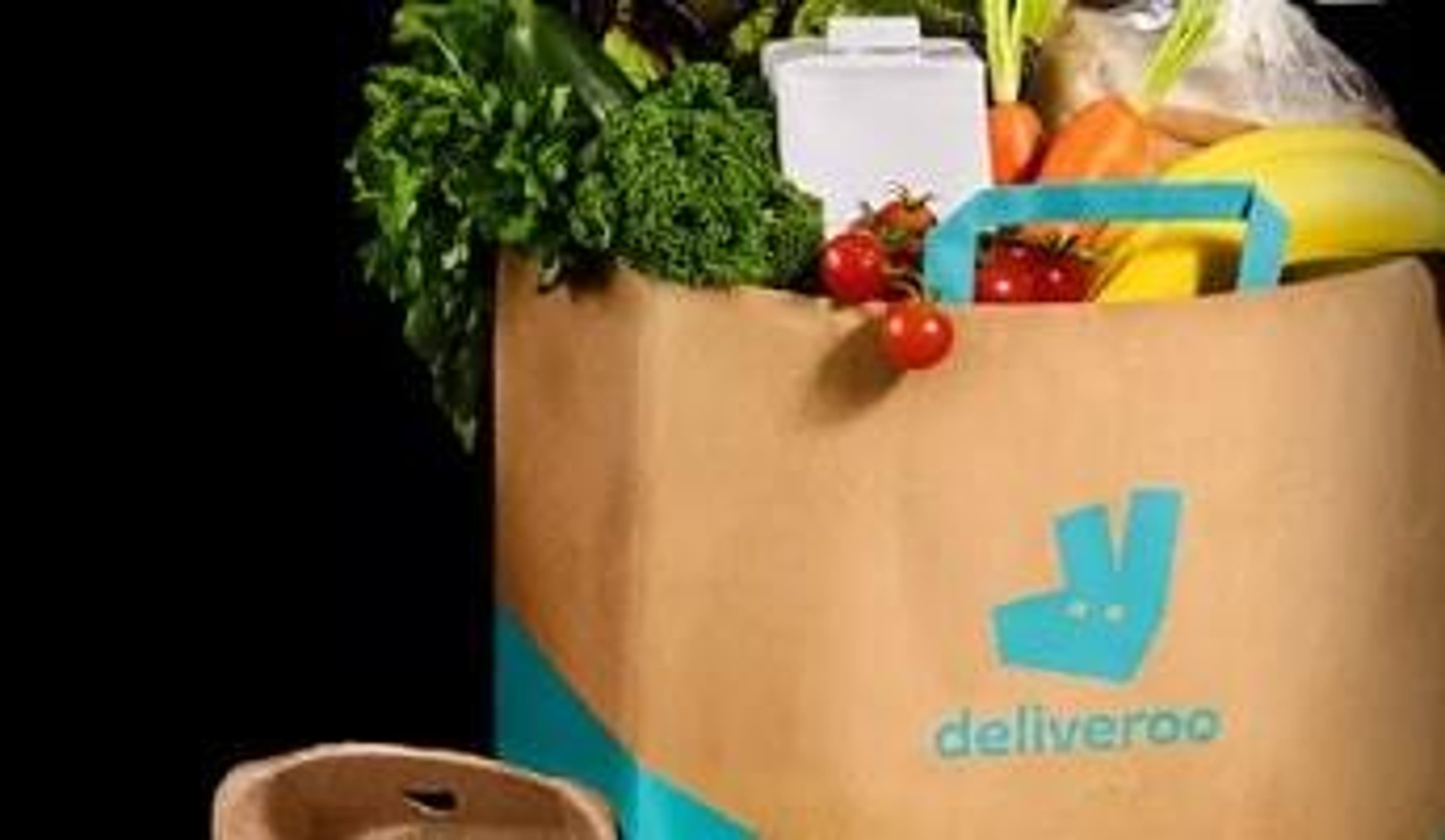  A selection of fresh groceries in a Deliveroo bag ready to be delivered. 