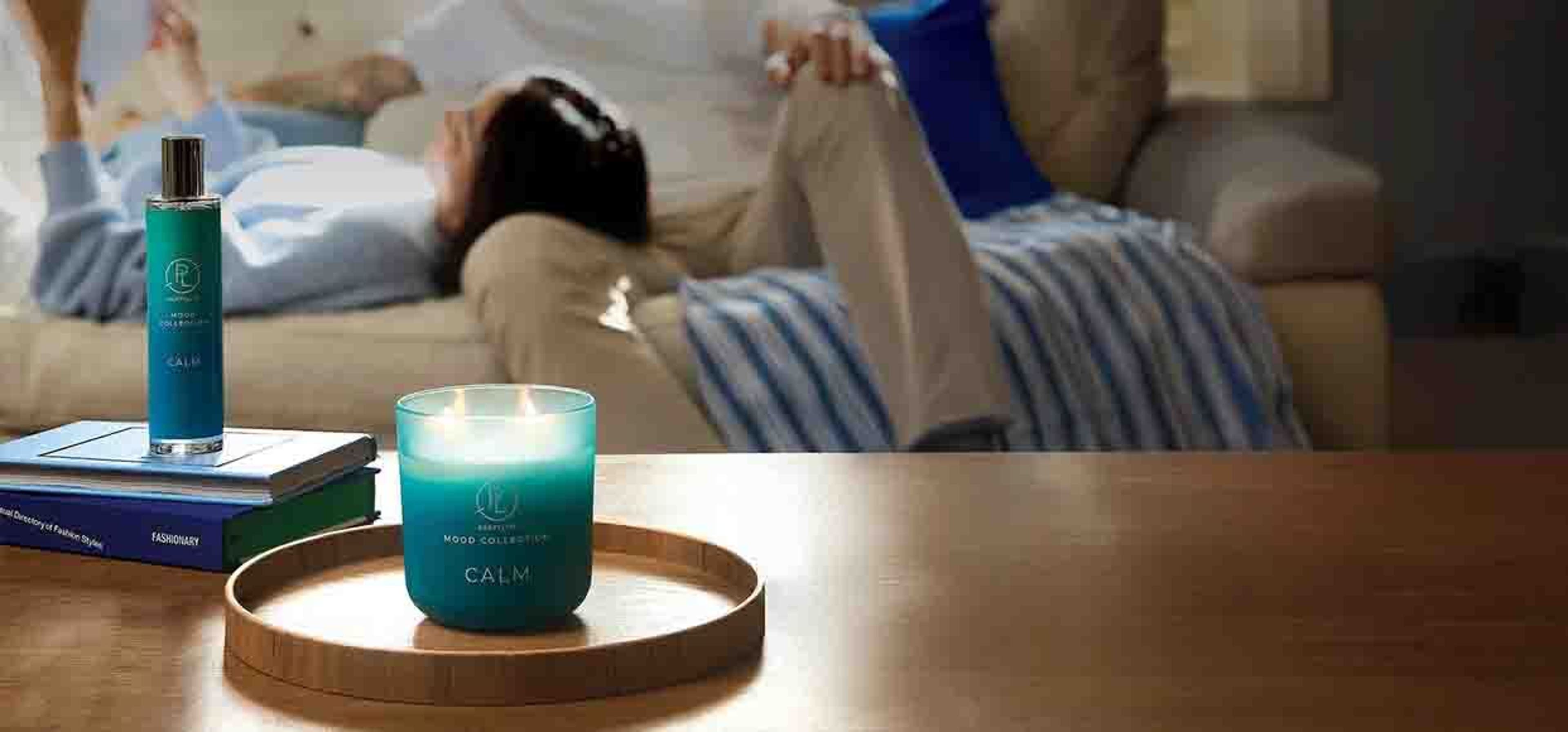 picture of a blue candle labelled 'calm' on a living room table