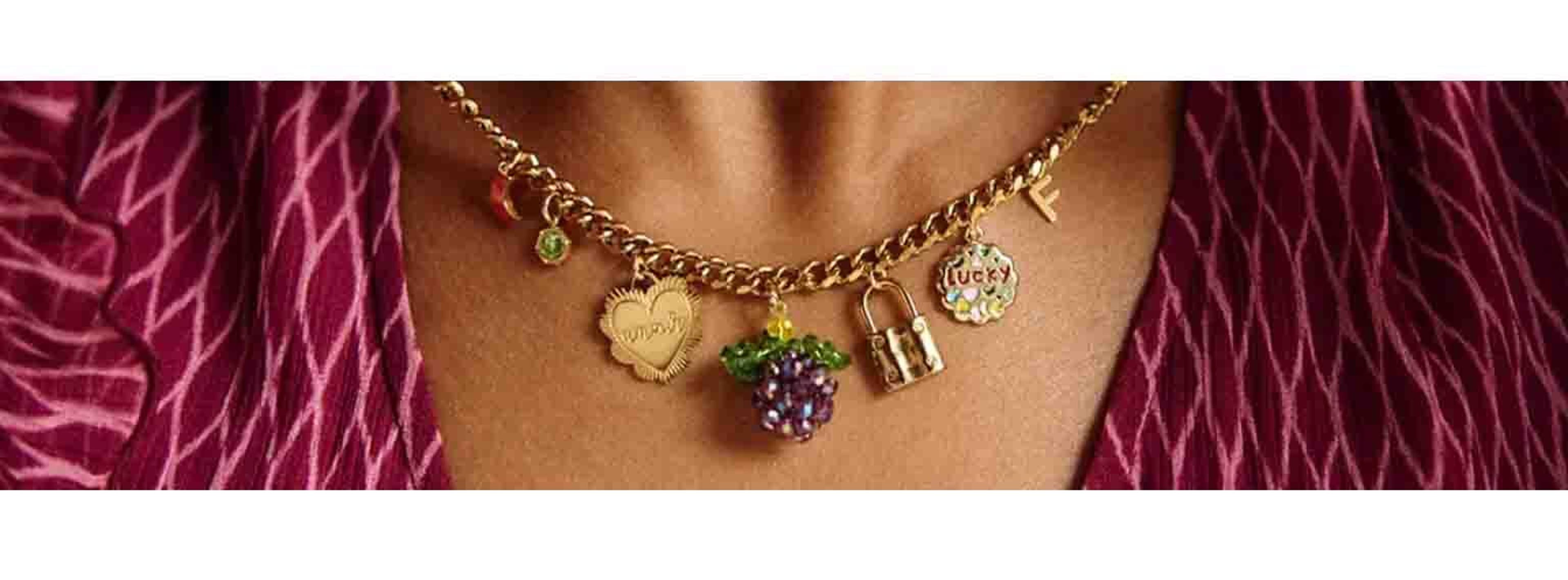 close up shot of a woman wearing a chunk necklace with gems