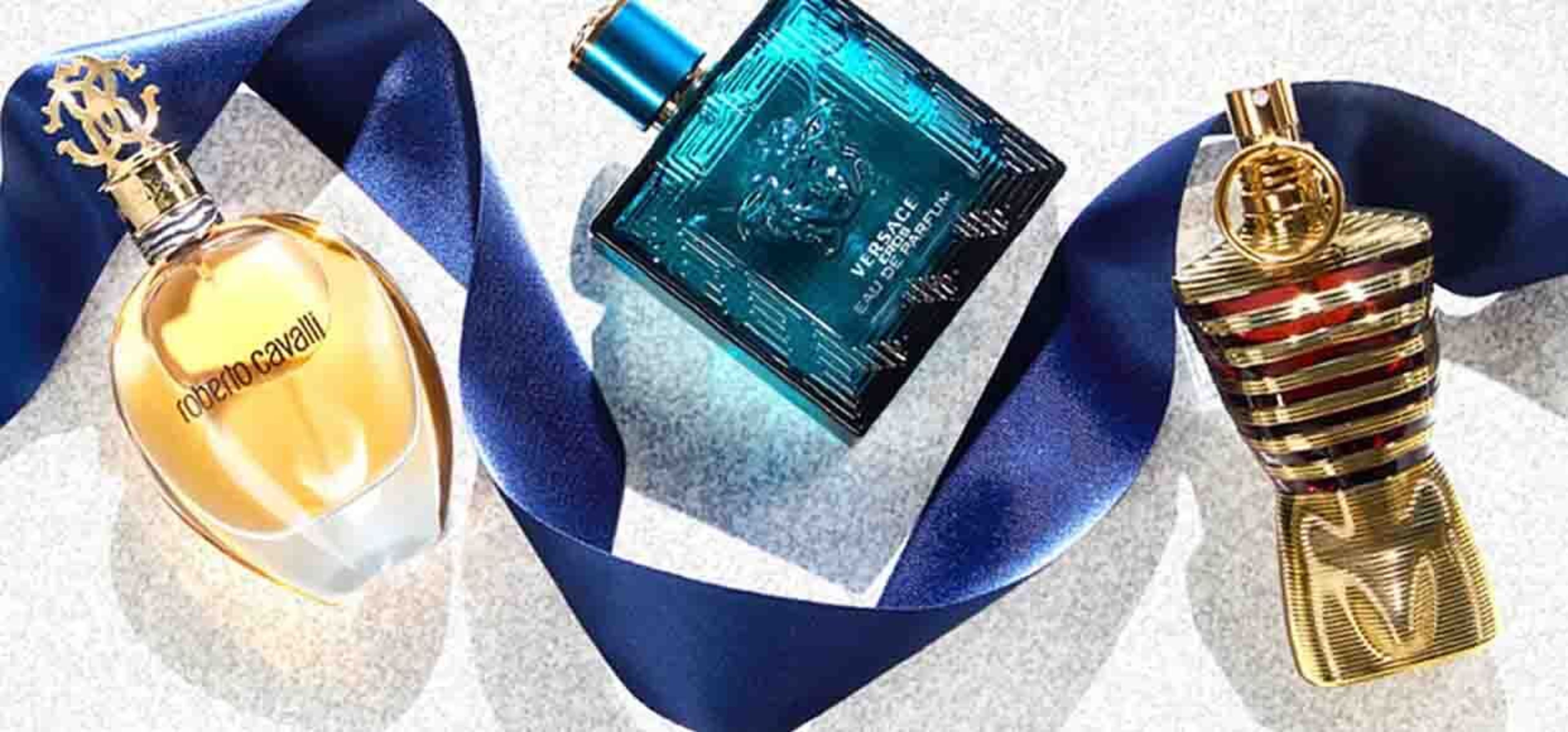 versace perfume with blue ribbon and two other perfume products