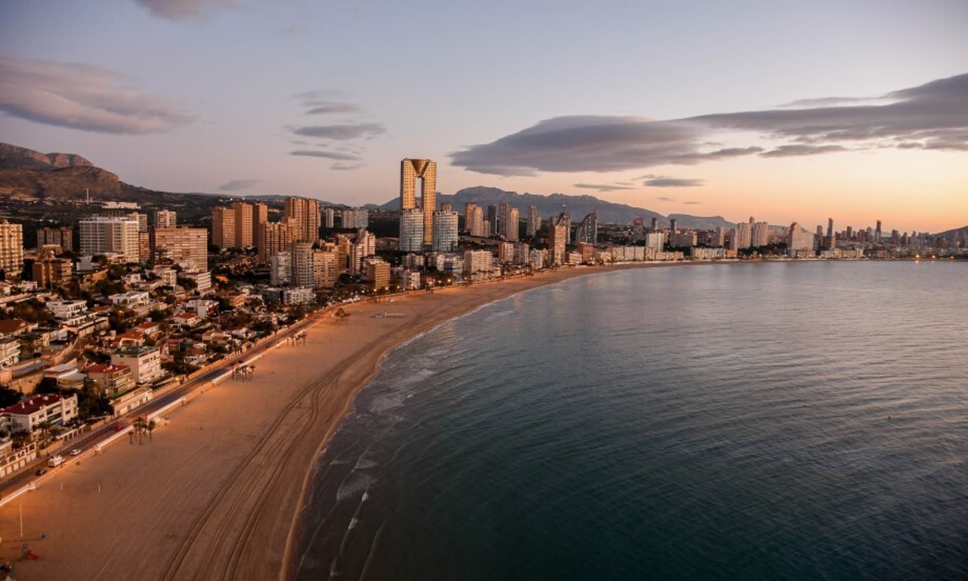  Aerial view of the Benidorm coastline on a sunny evening 