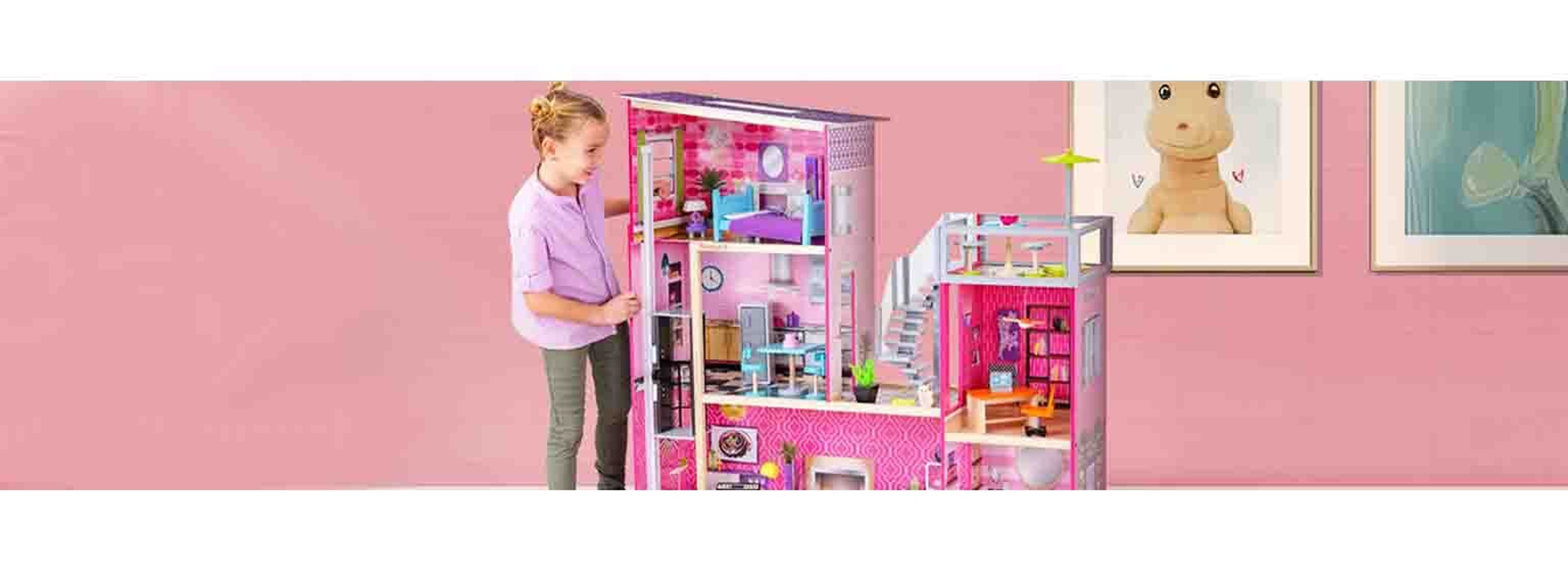 little girl with massive doll house
