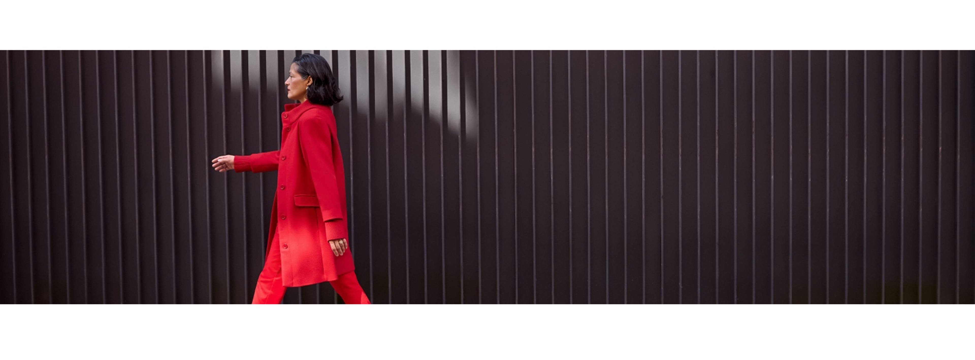 women in red outfit walking