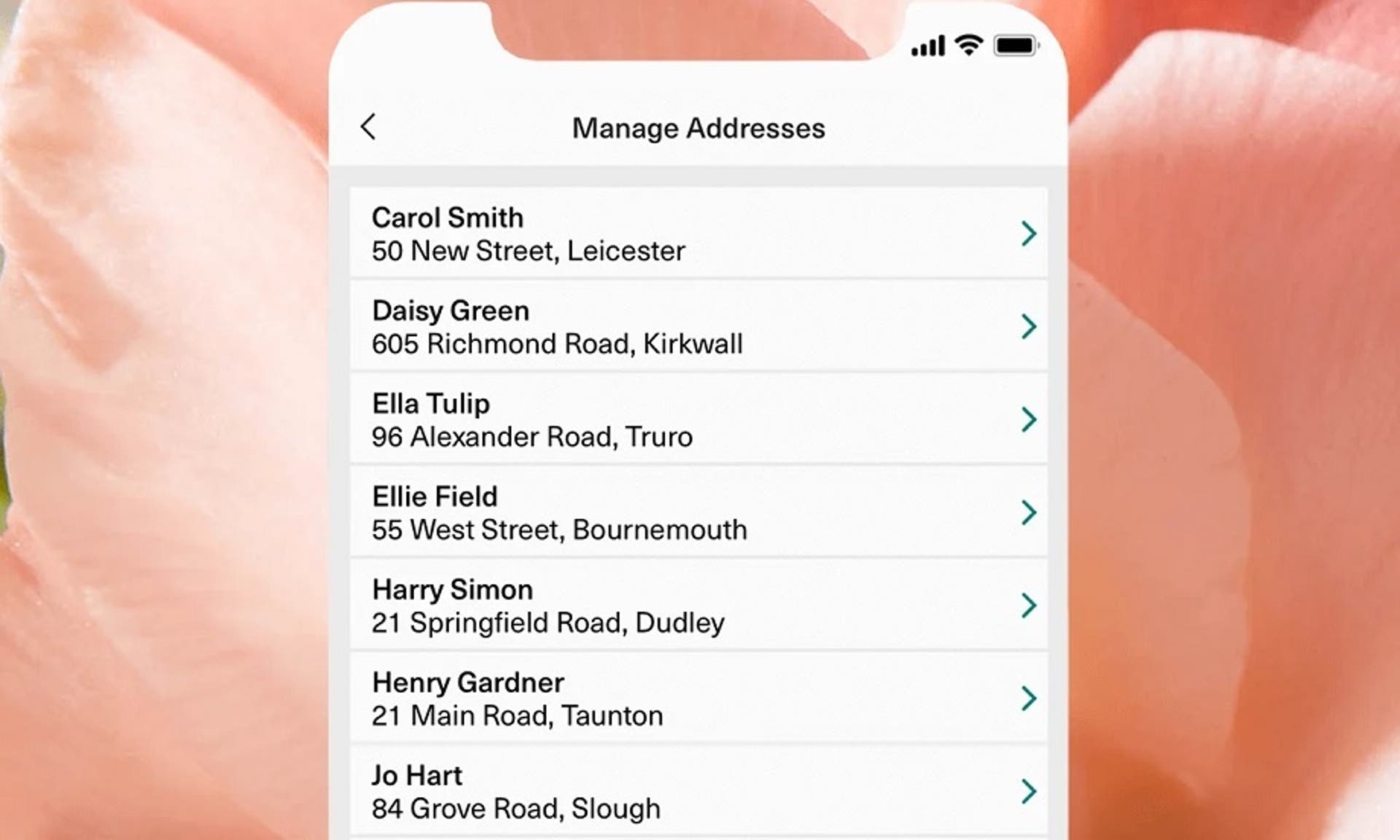  A screenshot of the address management screen on the Bloom & Wild app against a backdrop of an image of a flower 