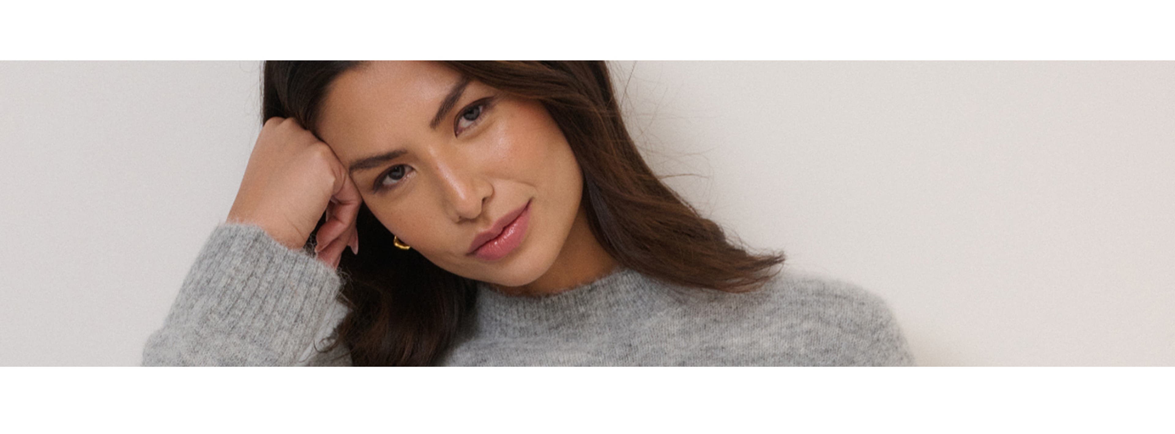 woman in grey jumper