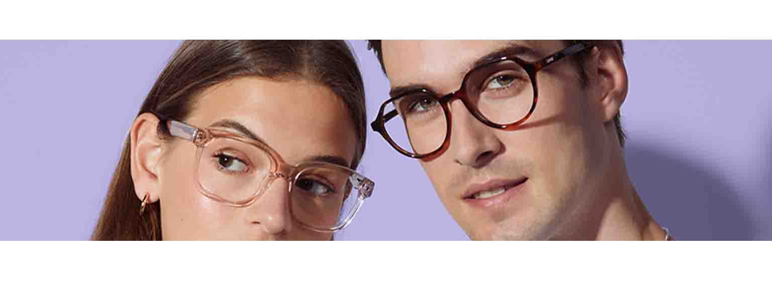  two people posing in glasses back to back  